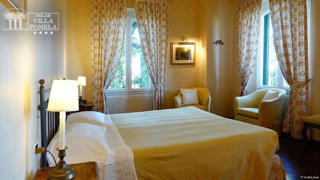 Bed in Relais Villa Pomela