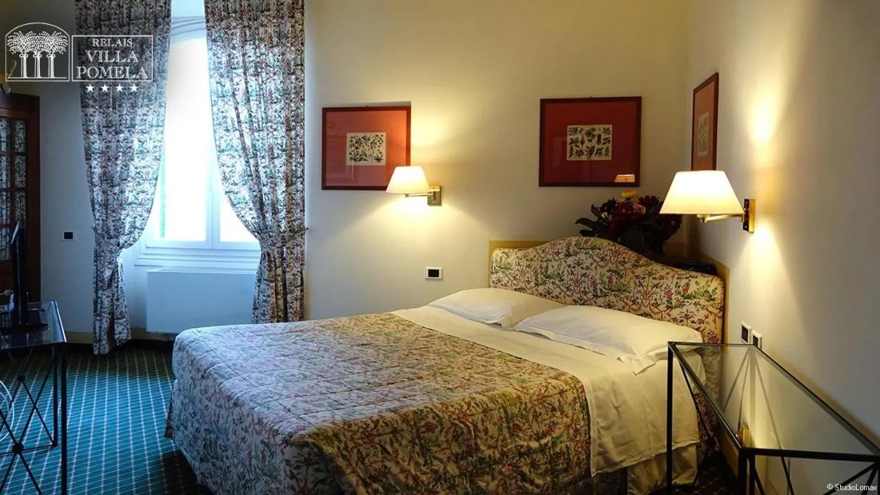 Bed in Relais Villa Pomela