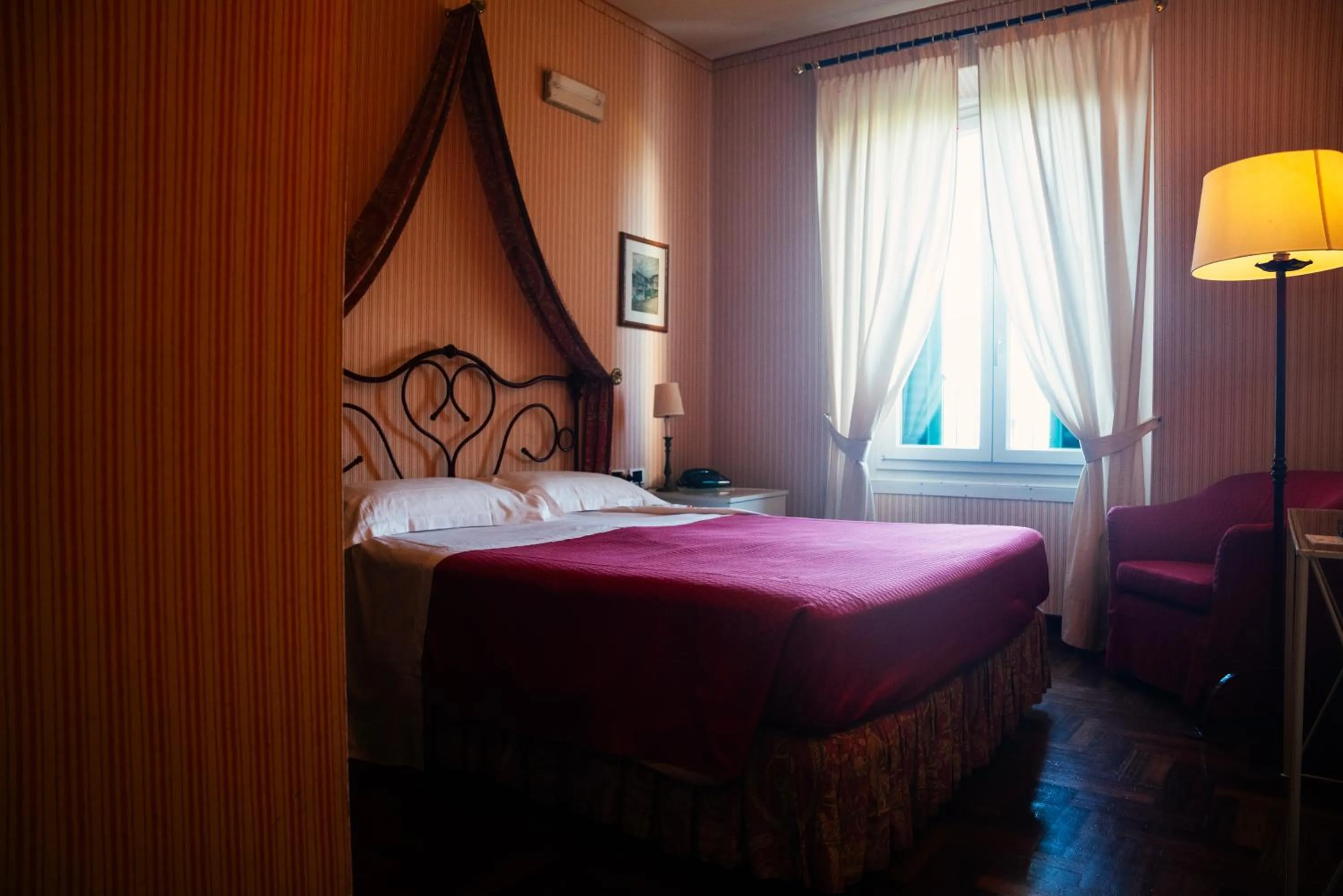 Bed in Relais Villa Pomela