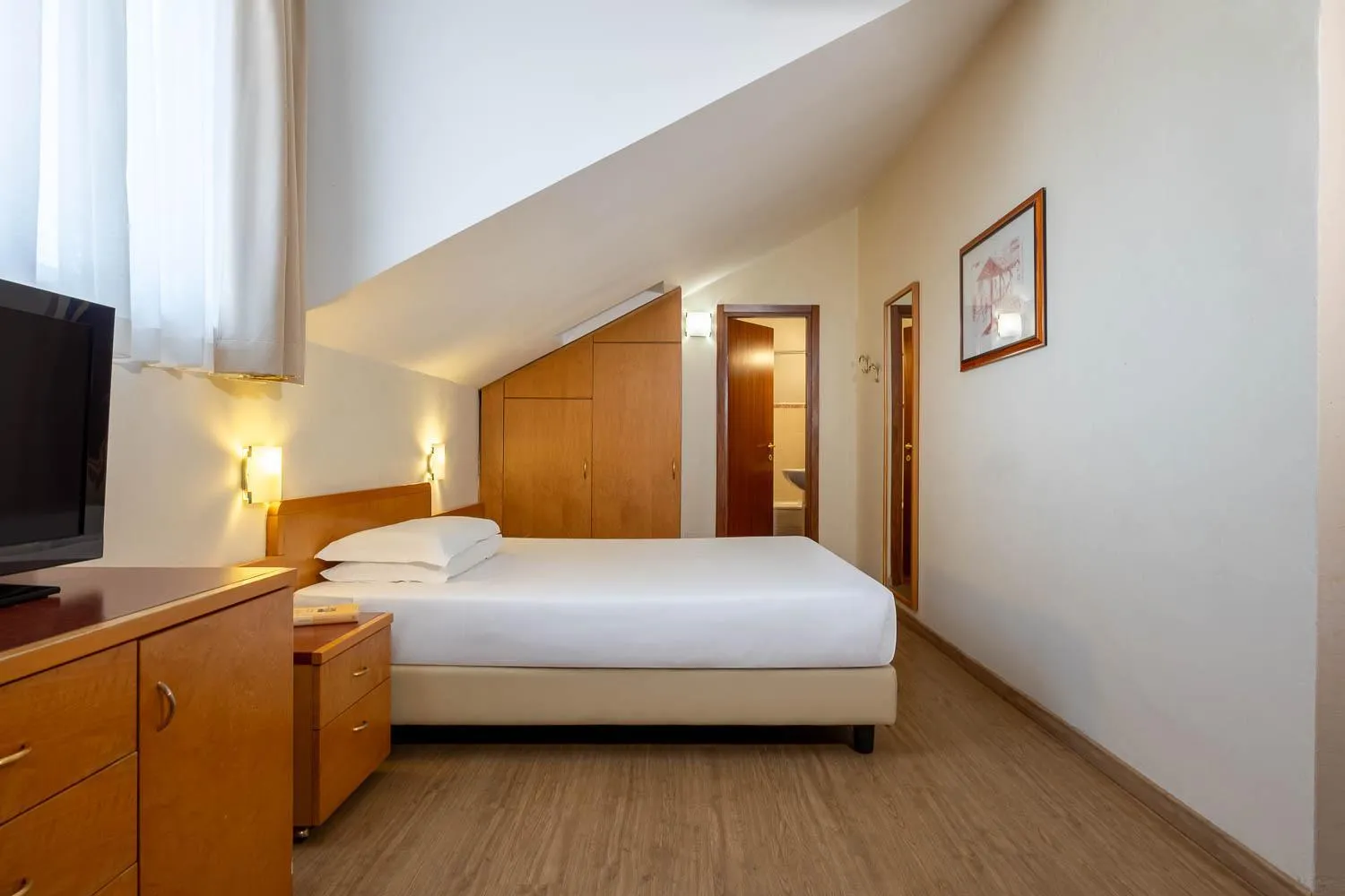 Bed in iH Hotels Milano ApartHotel Argonne Park