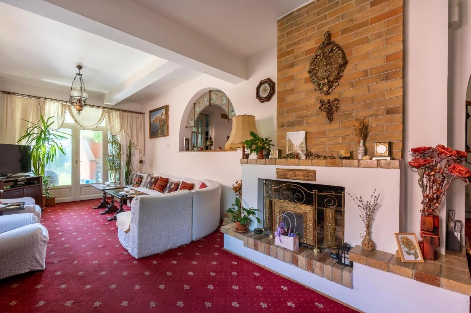 Communal lounge/ TV room in Villa-Hotel Escala