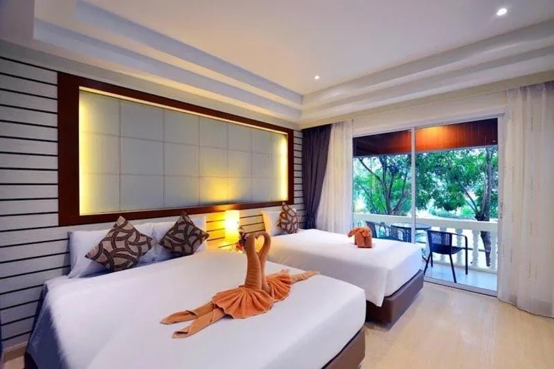 Bed in Windmill Resort Hotel Pattaya