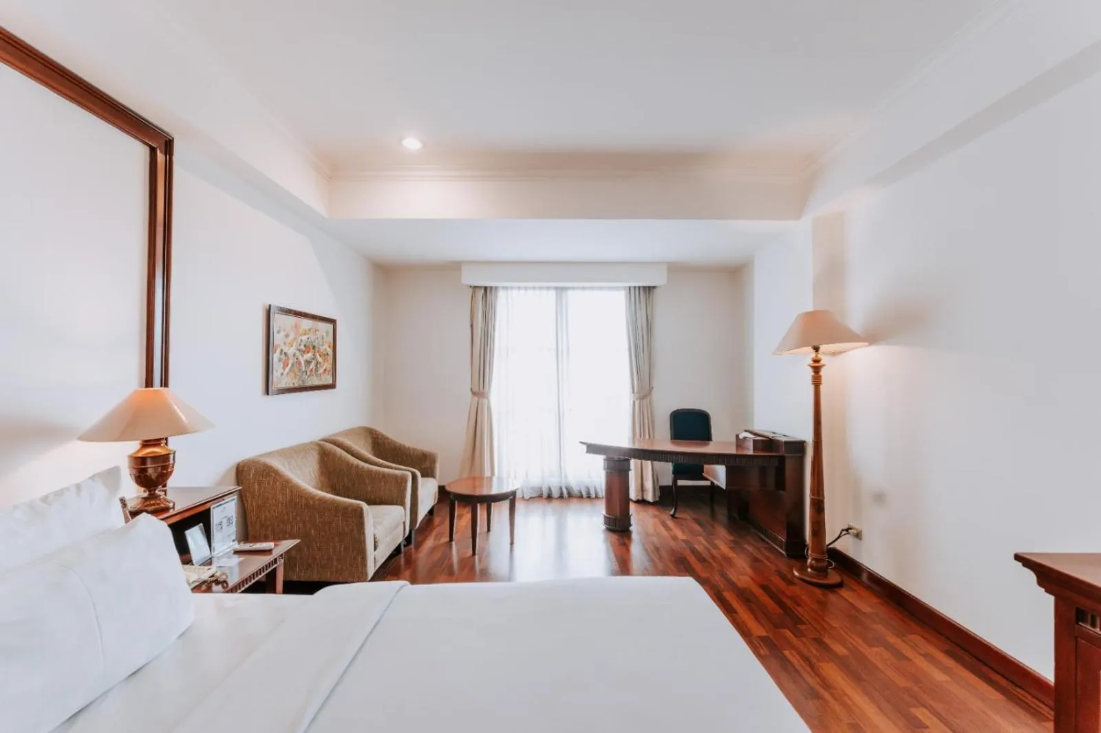 Bed in Arion Suites Hotel