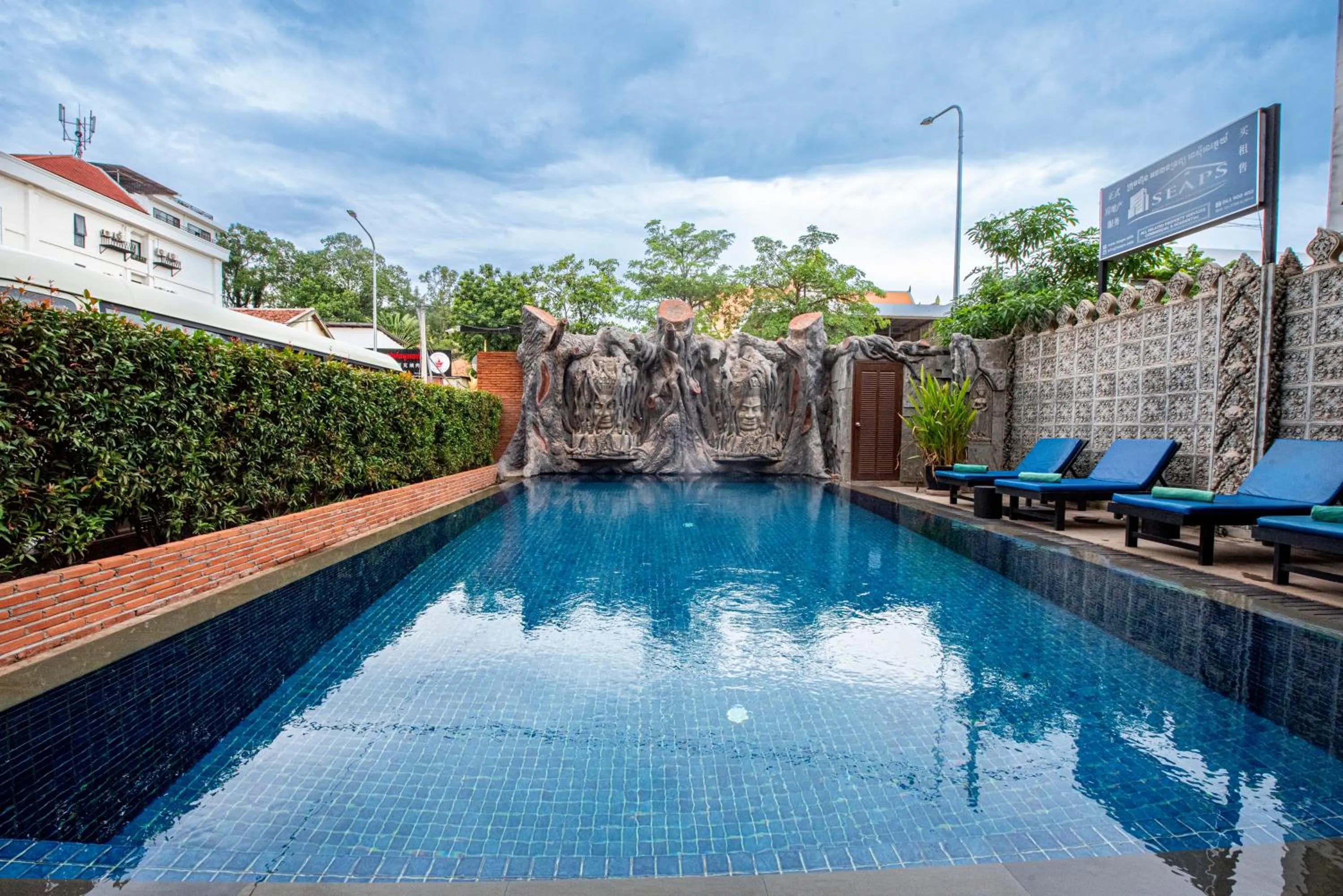 Swimming pool in The Suite By Royal Crown Hotel