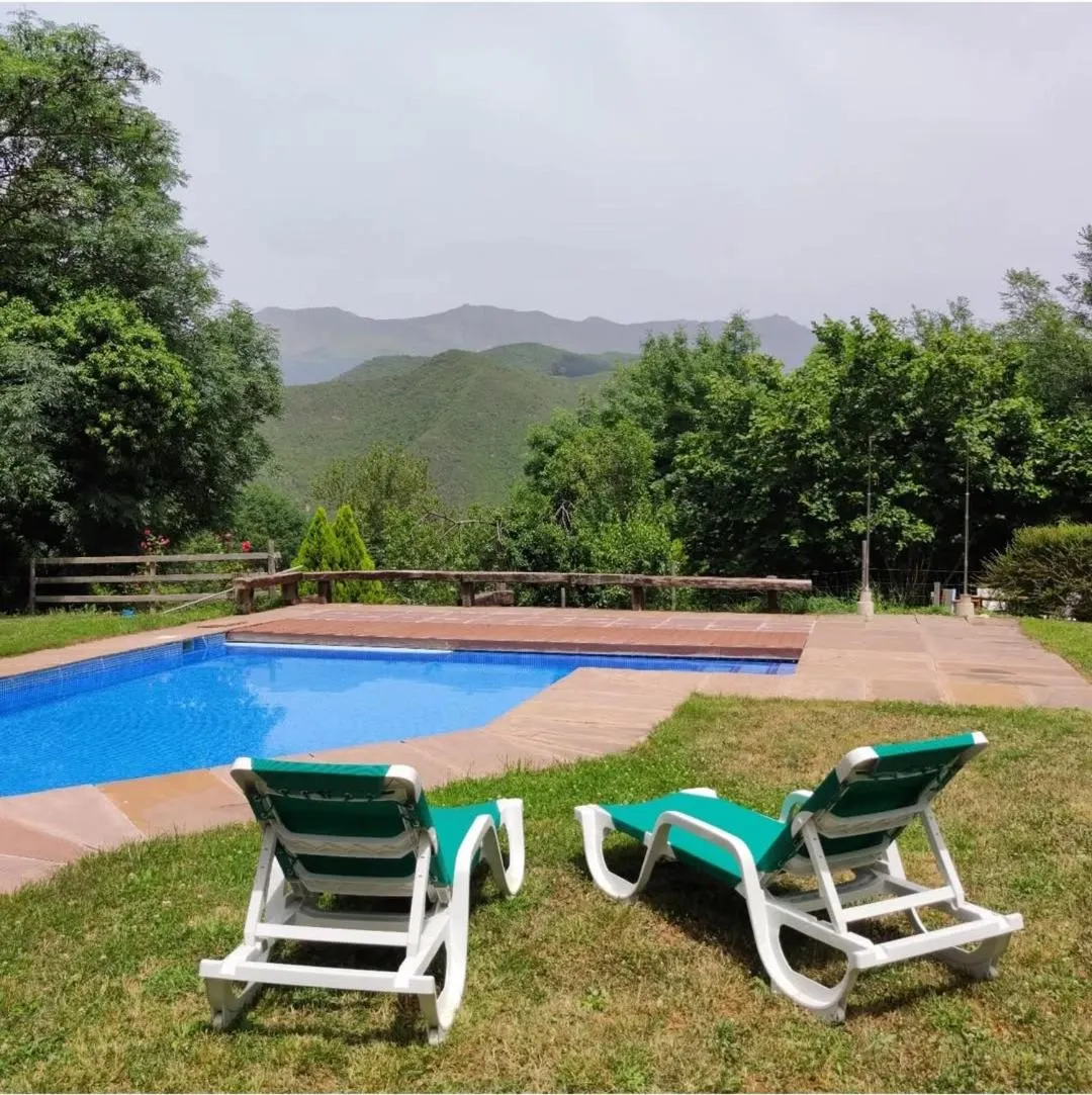 Swimming pool in Viviendas Rurales El Covaju