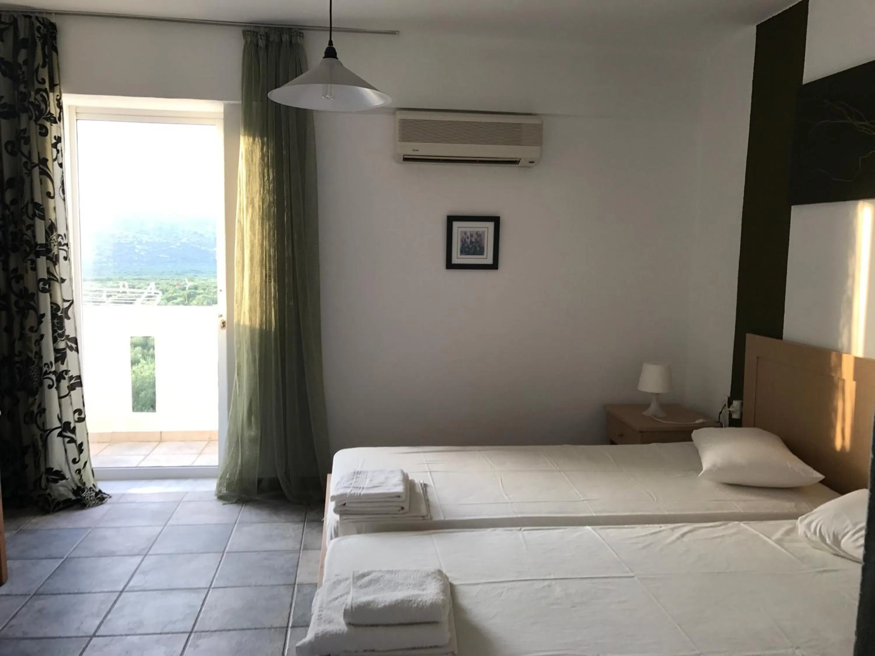 Garden view, Bed in Tholos Rooms