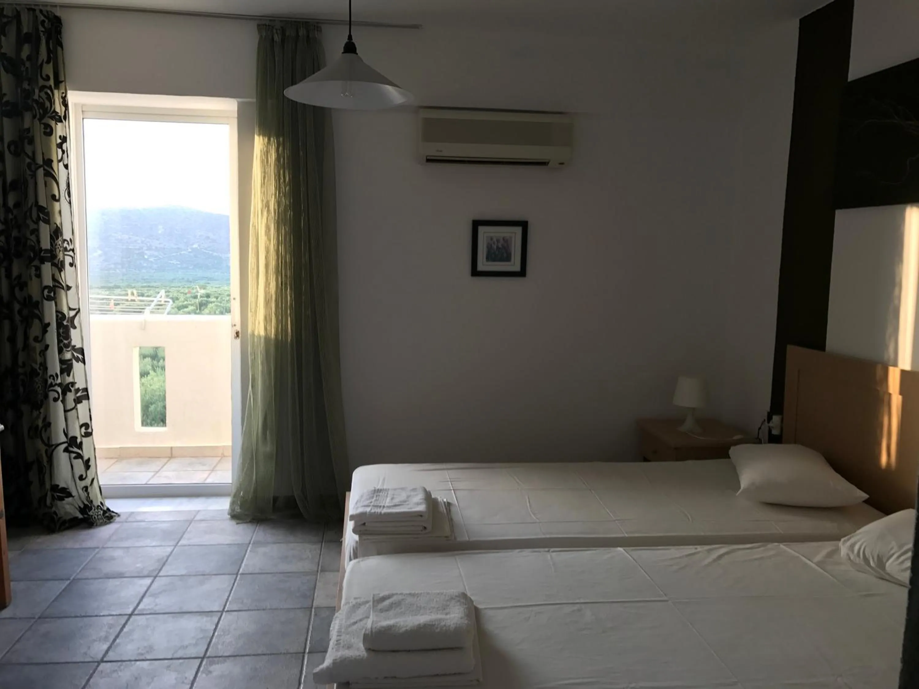 Garden view, Bed in Tholos Rooms