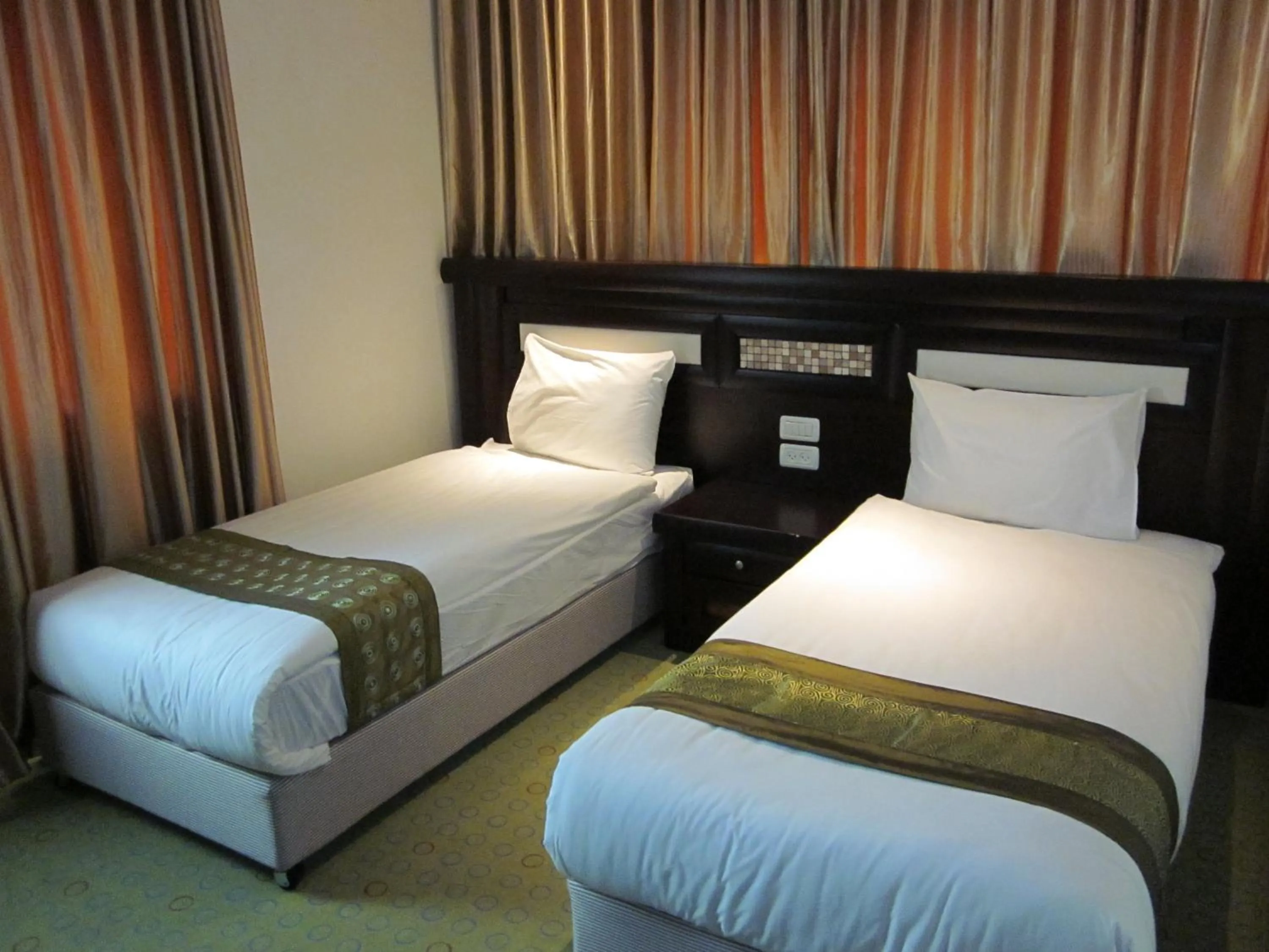 Bed in Commodore Hotel