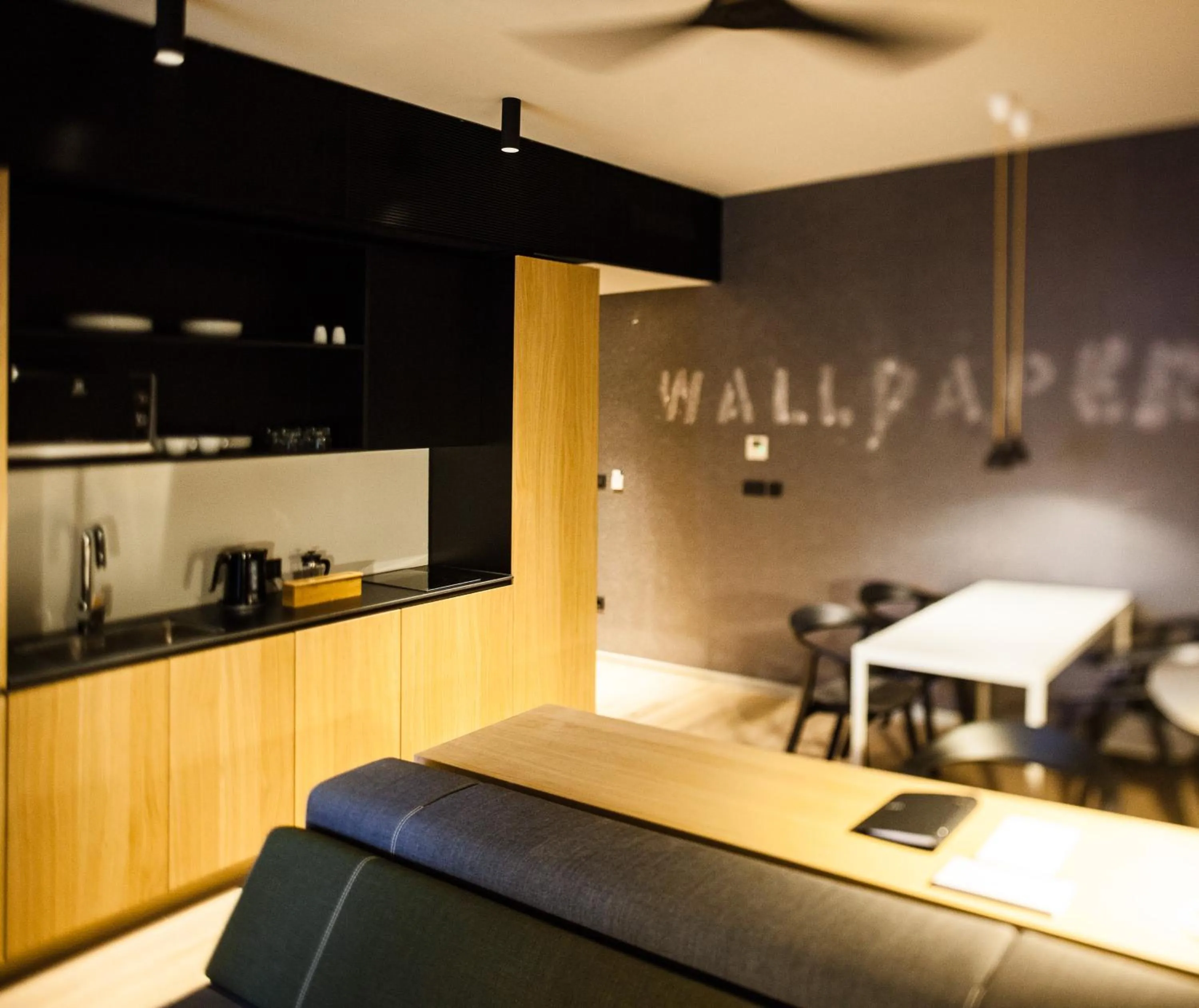 Kitchen or kitchenette in One Suite Hotel