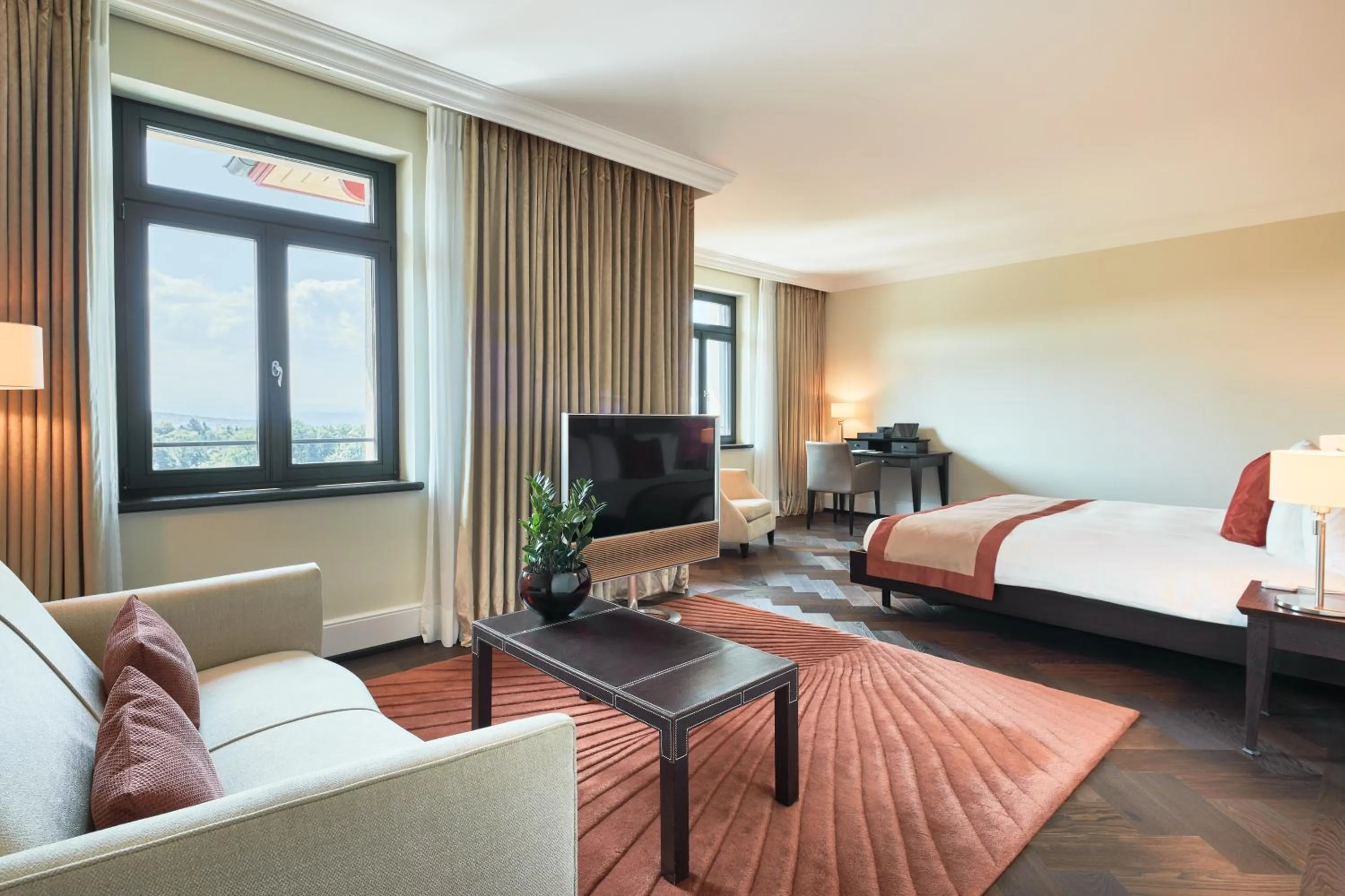 Communal lounge/ TV room, Bed in The Dolder Grand - City and Spa Resort Zurich