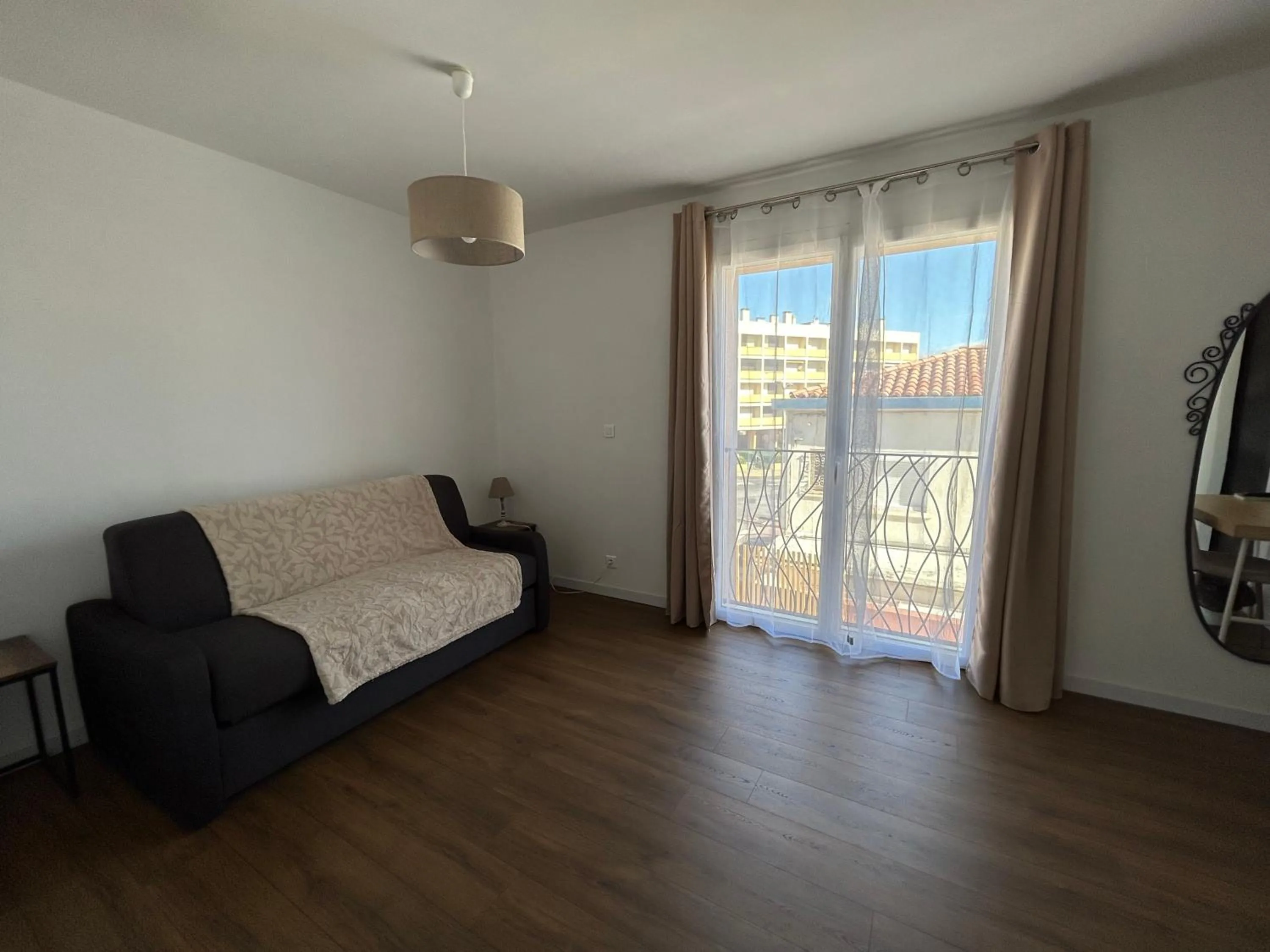 Living room, Bed in Logis Hotel De La Clape