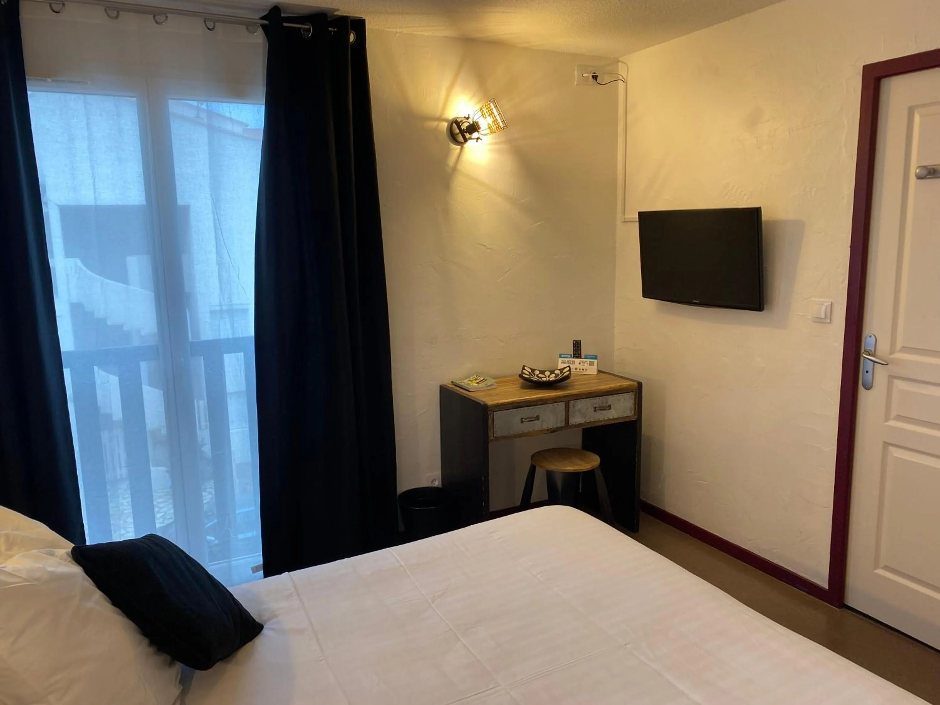 Photo of the whole room, Bed in Logis Hotel De La Clape