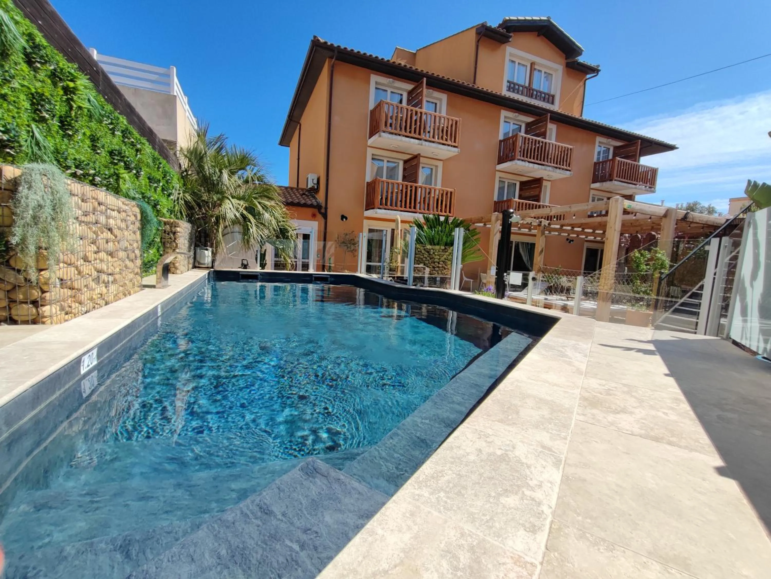 Swimming pool in Logis Hotel De La Clape