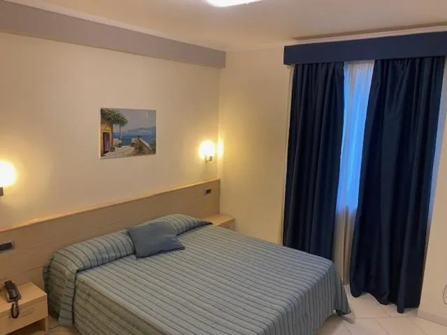 Bed in Hotel Cosmomare