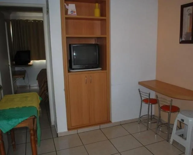 Living room in diRoma Fiori Caldas Novas - ACHEI FERIAS - Com Roupa de Cama