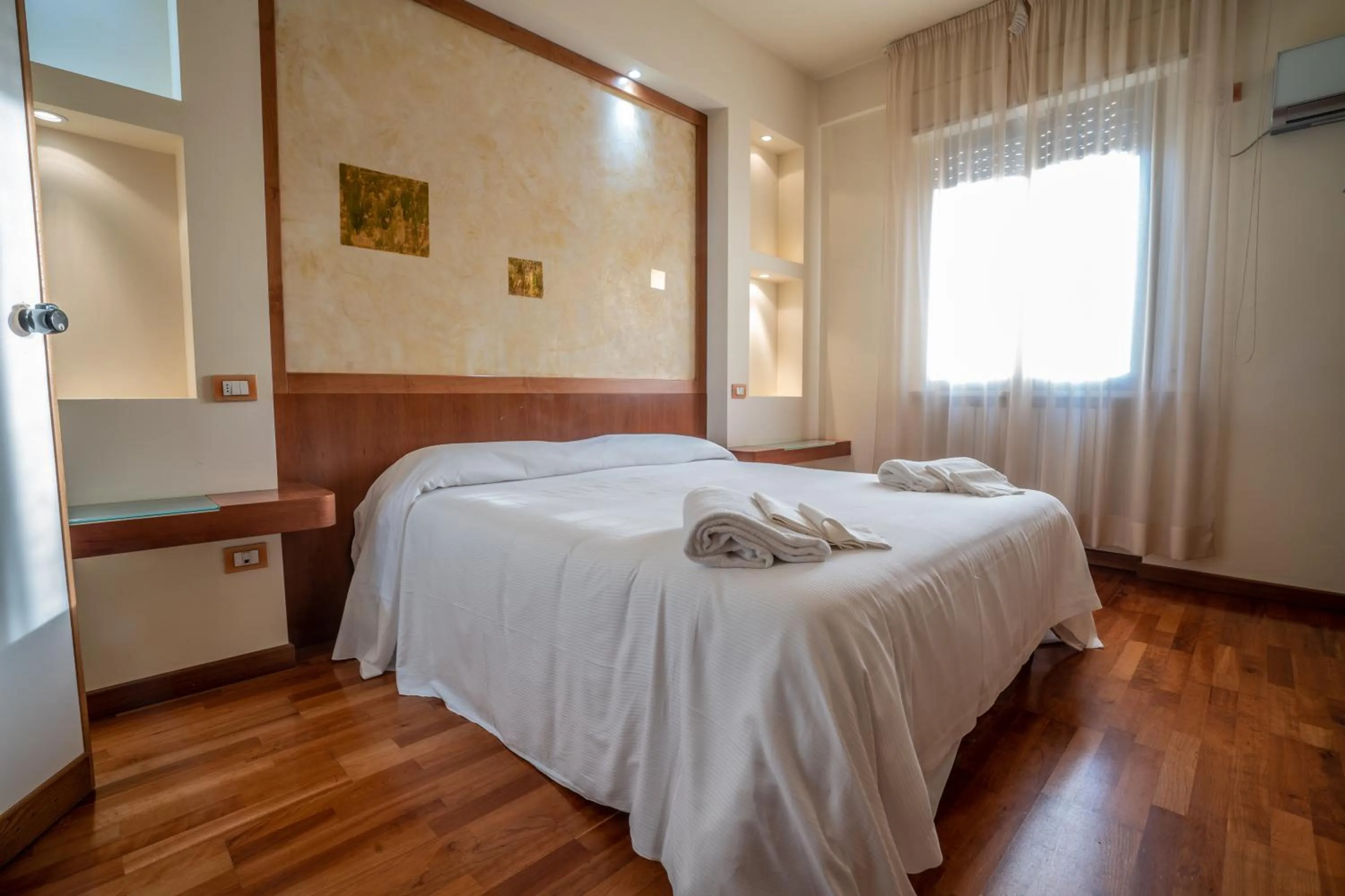 Bedroom in Le Grazie Hotel