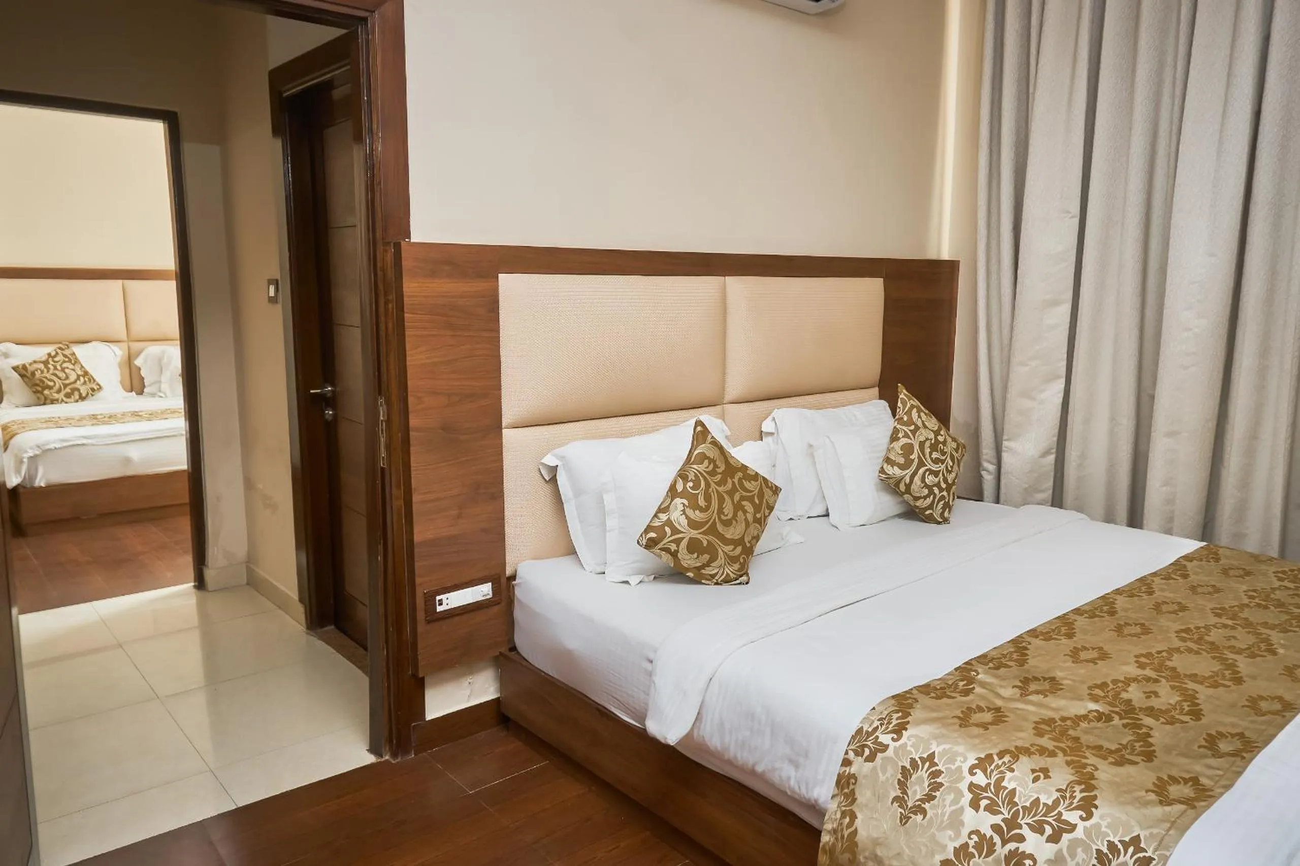 Photo of the whole room, Bed in Ganpati Hotel Katra