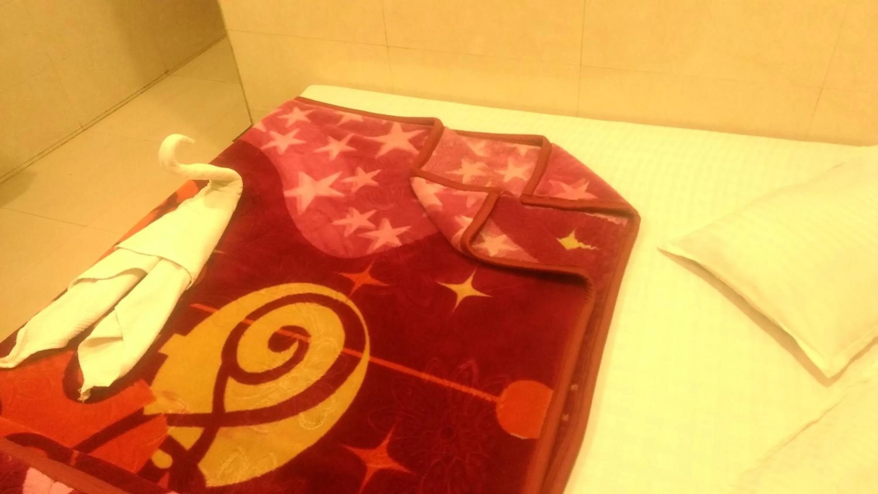 Bed in Ashiyana Inn Hotel
