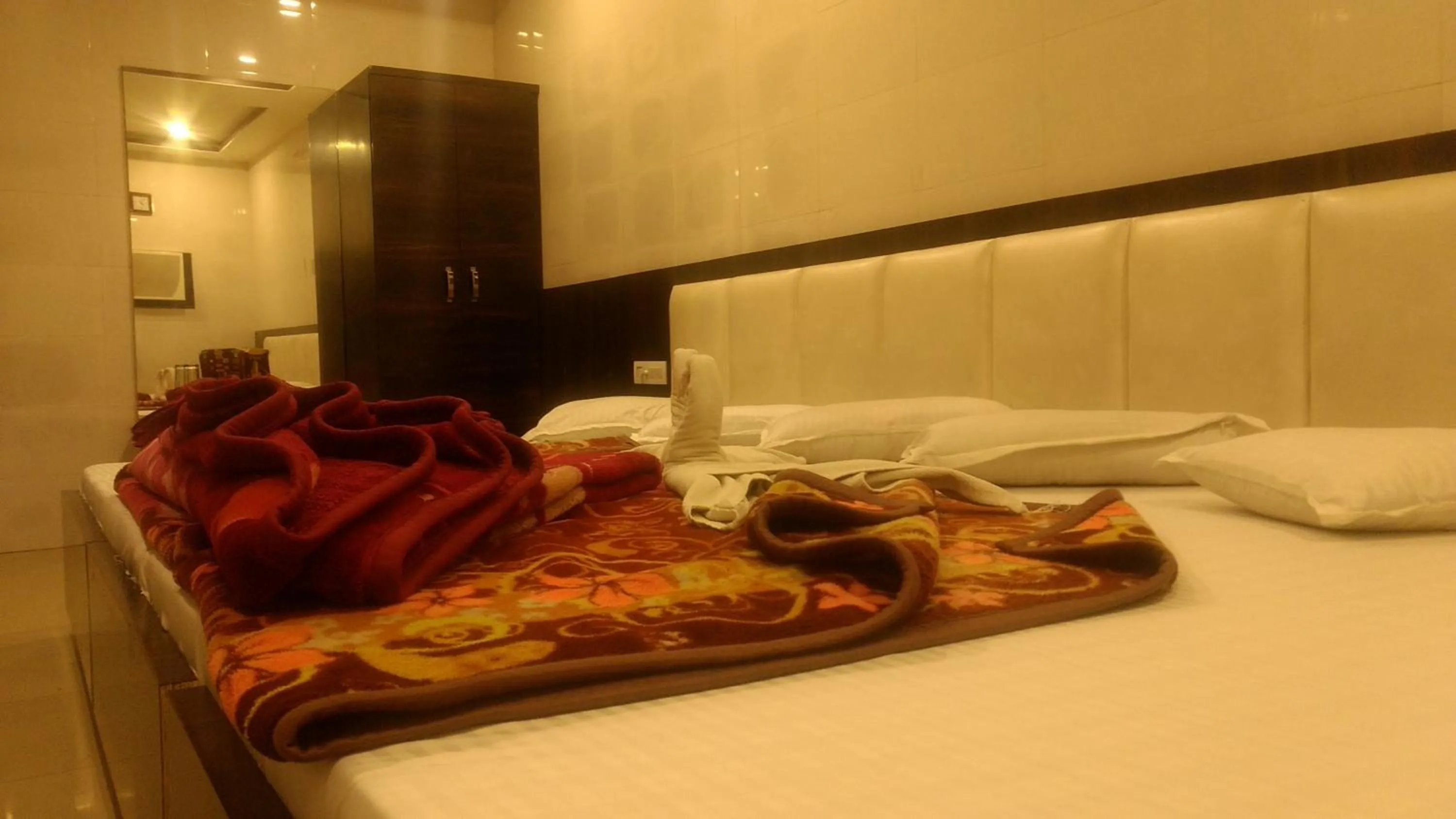 Bed in Ashiyana Inn Hotel