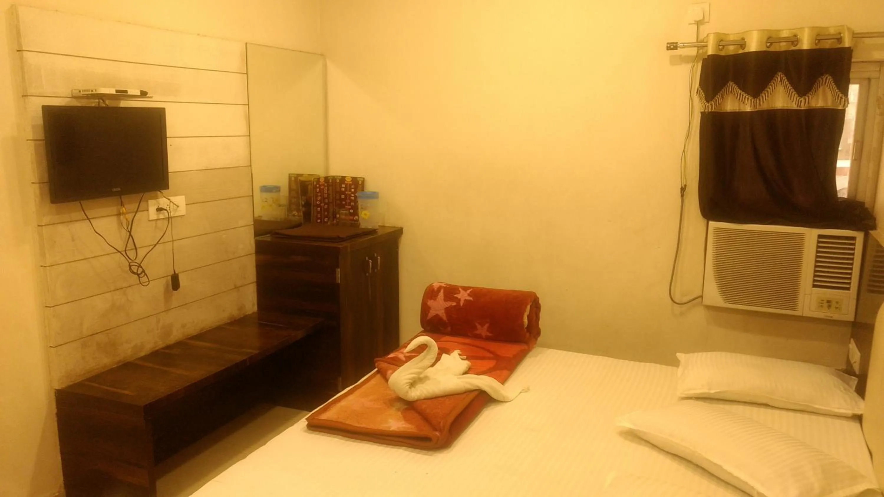 Bed in Ashiyana Inn Hotel