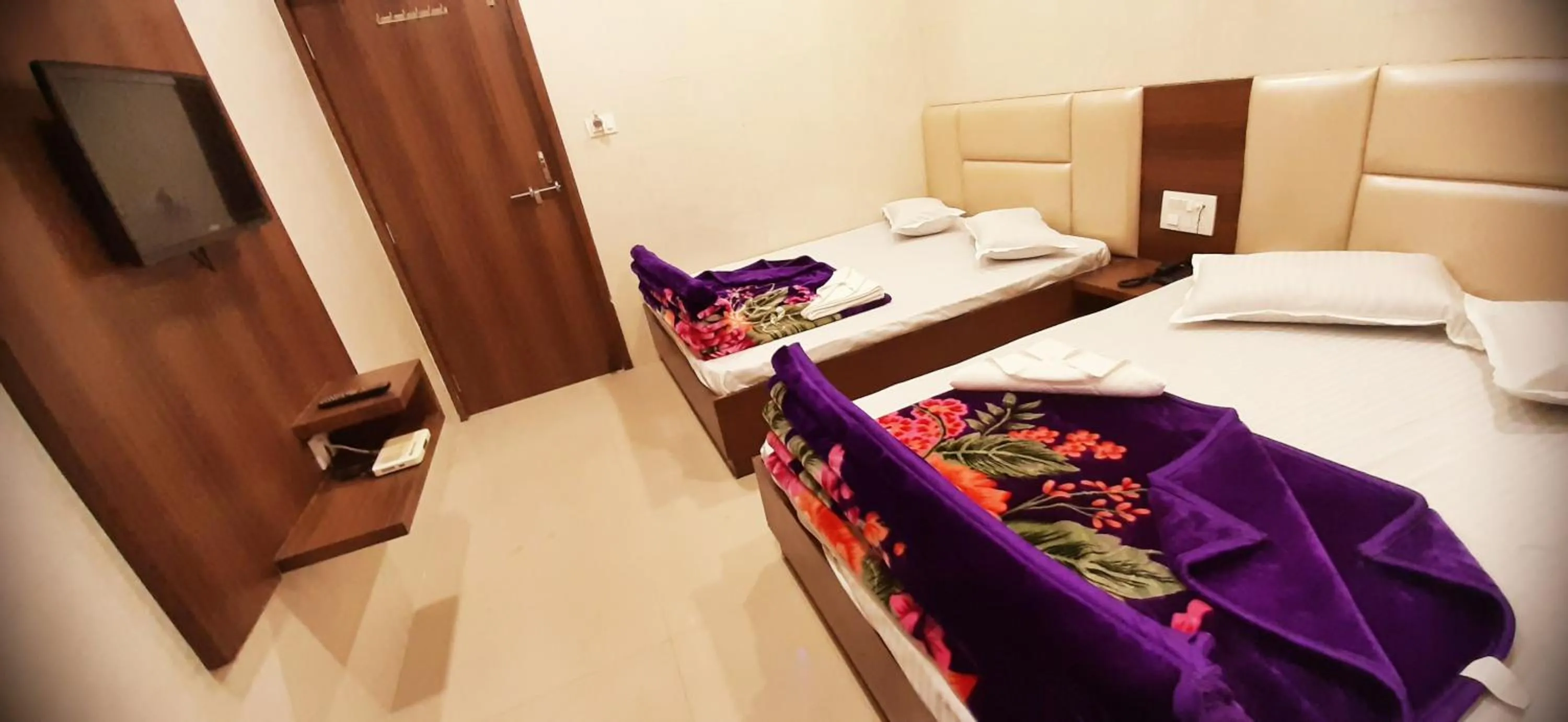 Bed in Ashiyana Inn Hotel