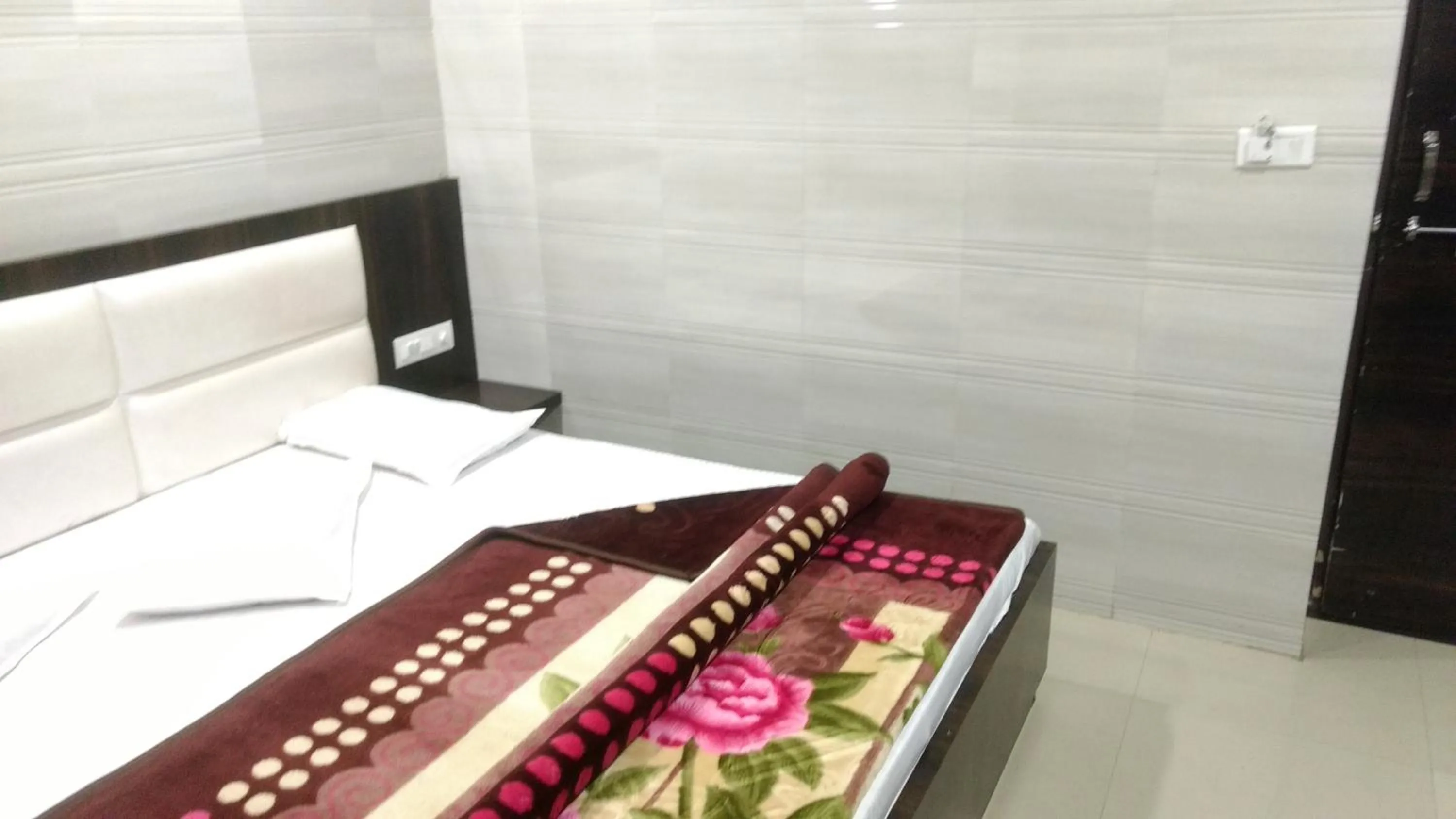 Bed in Ashiyana Inn Hotel
