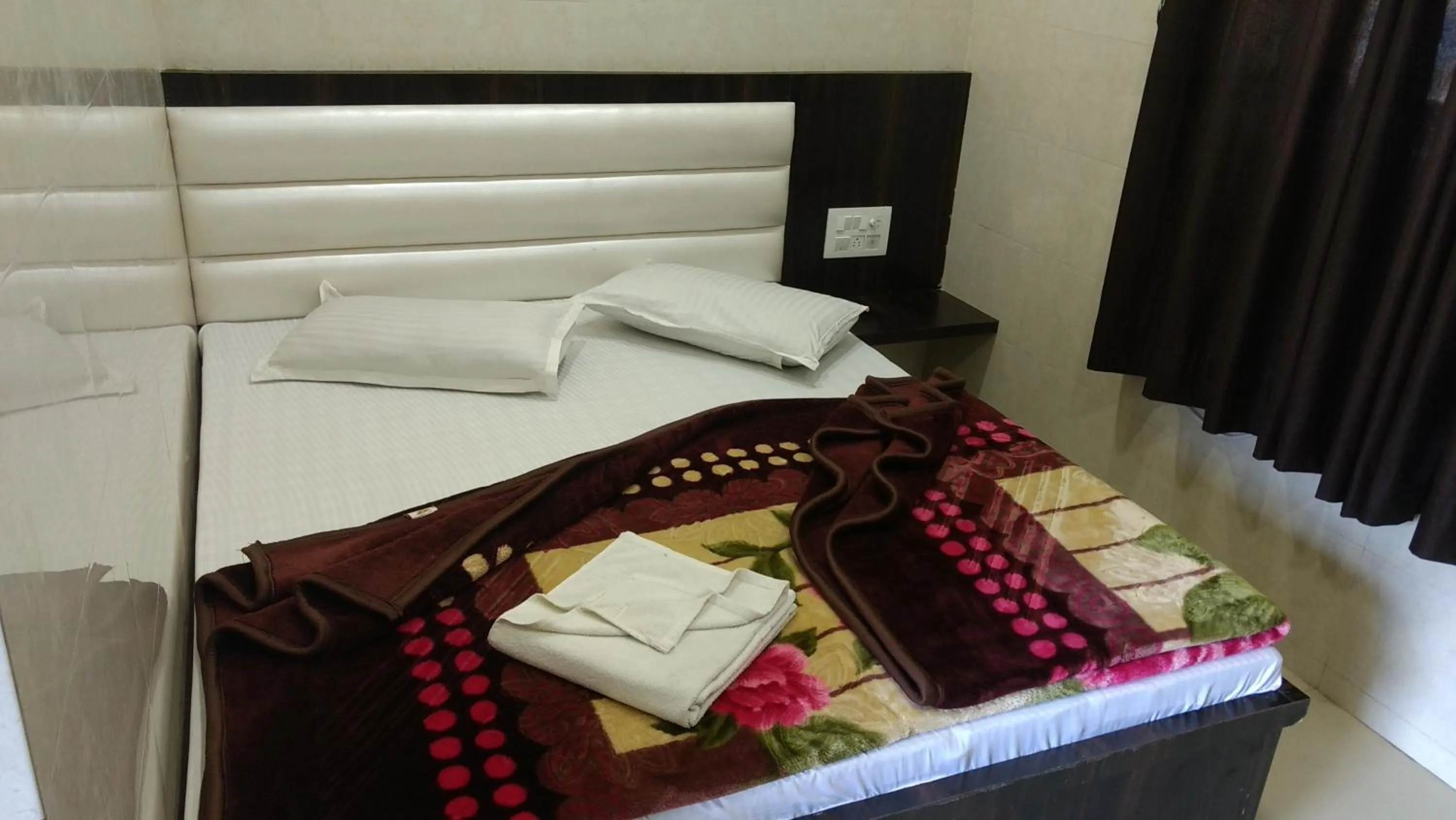 Bed in Ashiyana Inn Hotel