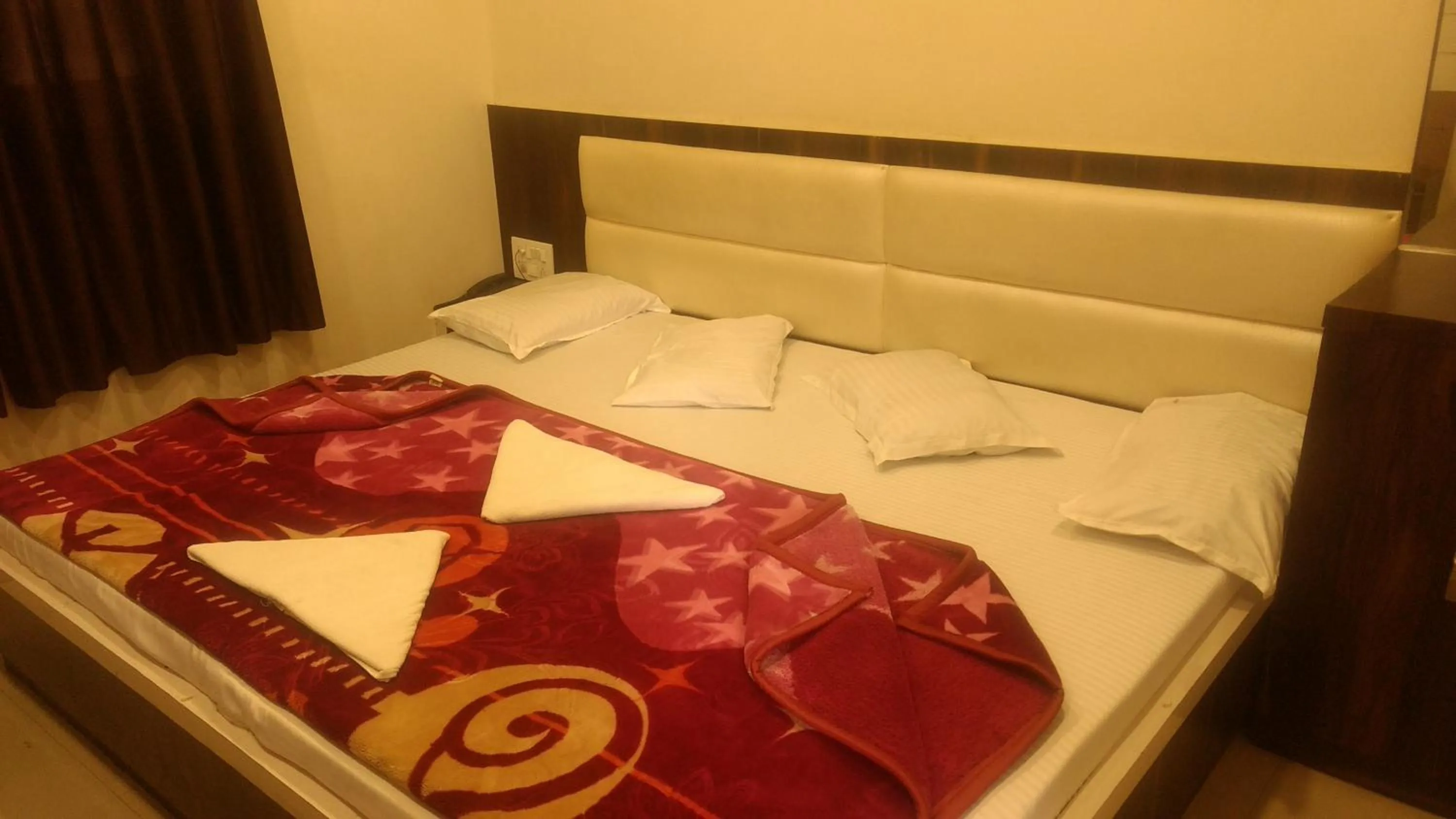 Bed in Ashiyana Inn Hotel