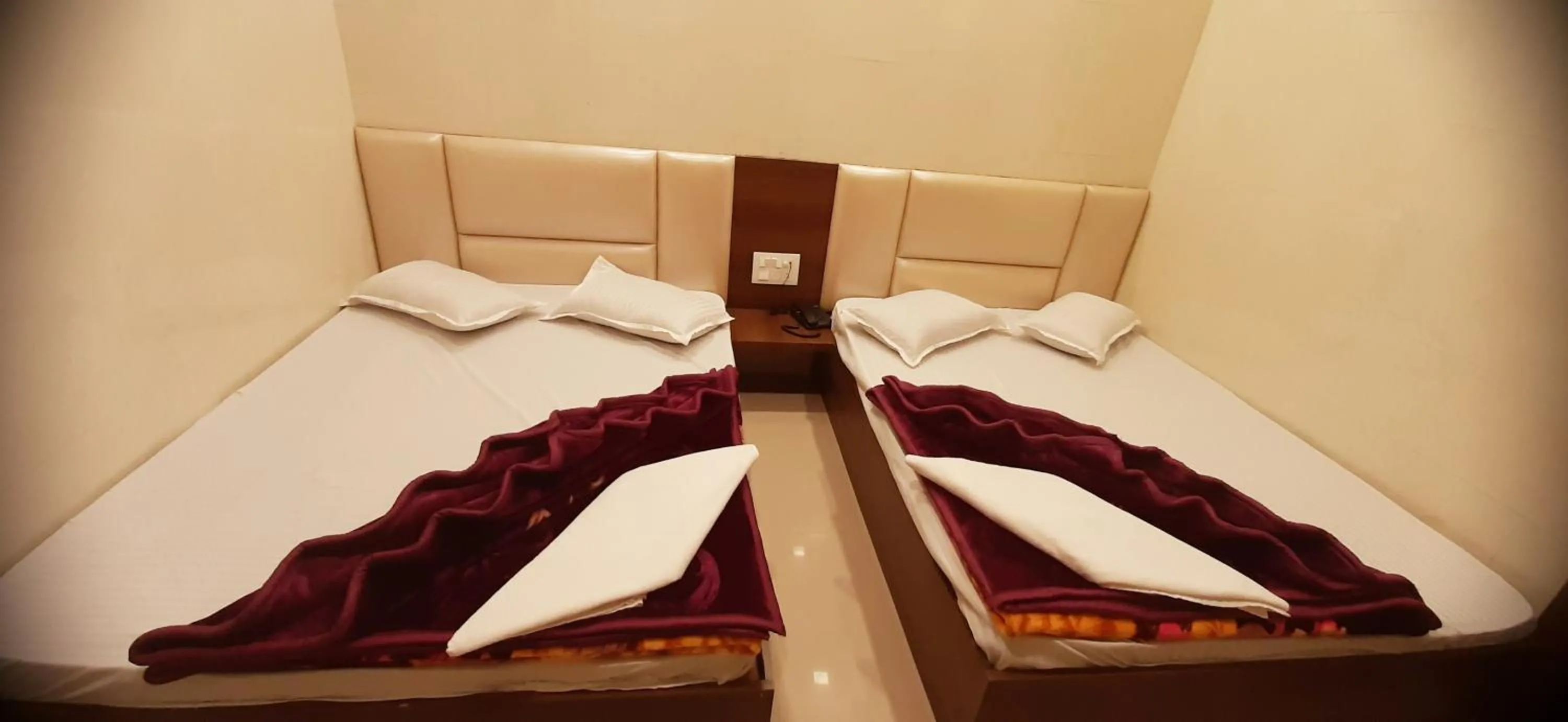 Bed in Ashiyana Inn Hotel