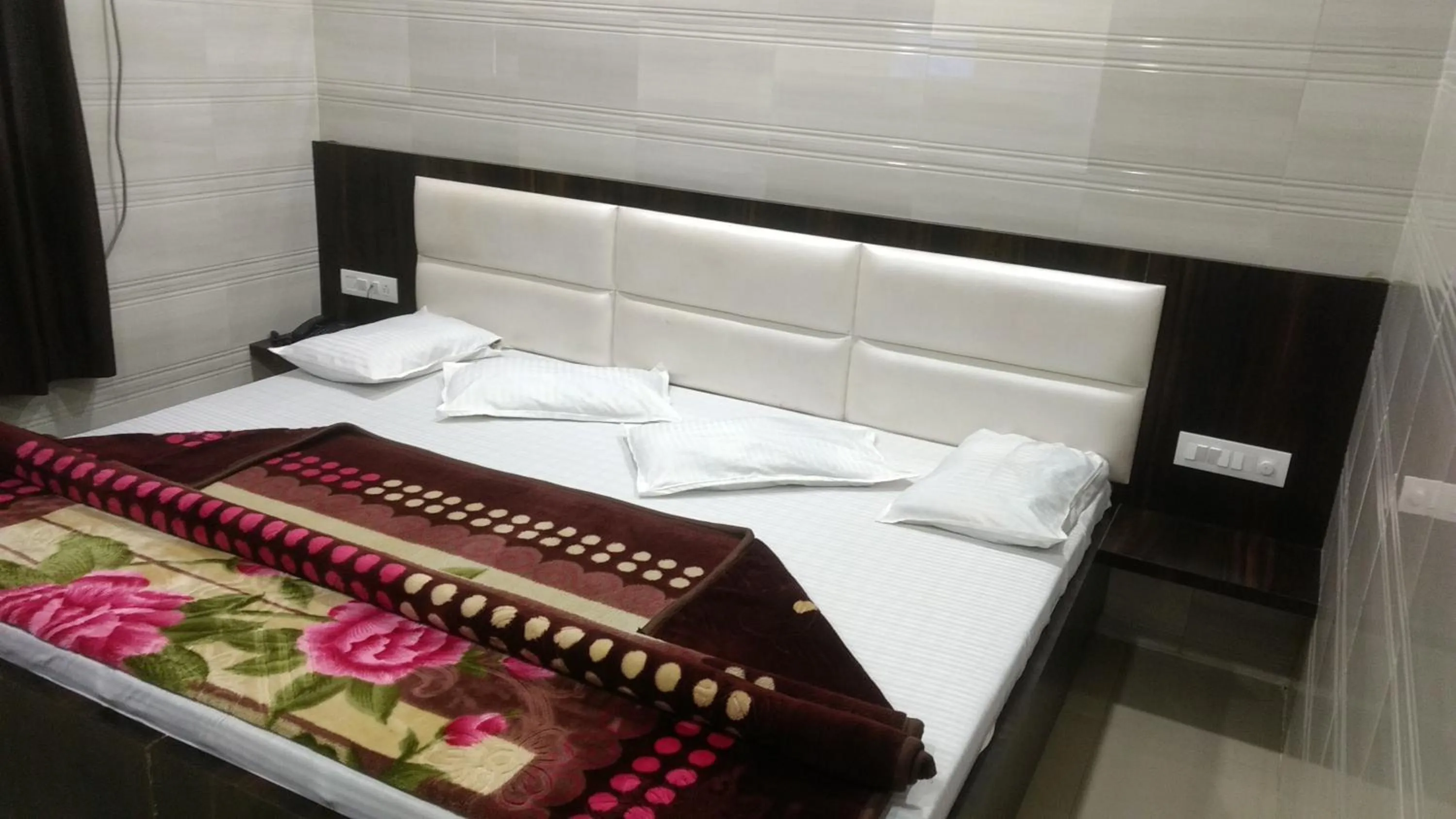 Bed in Ashiyana Inn Hotel
