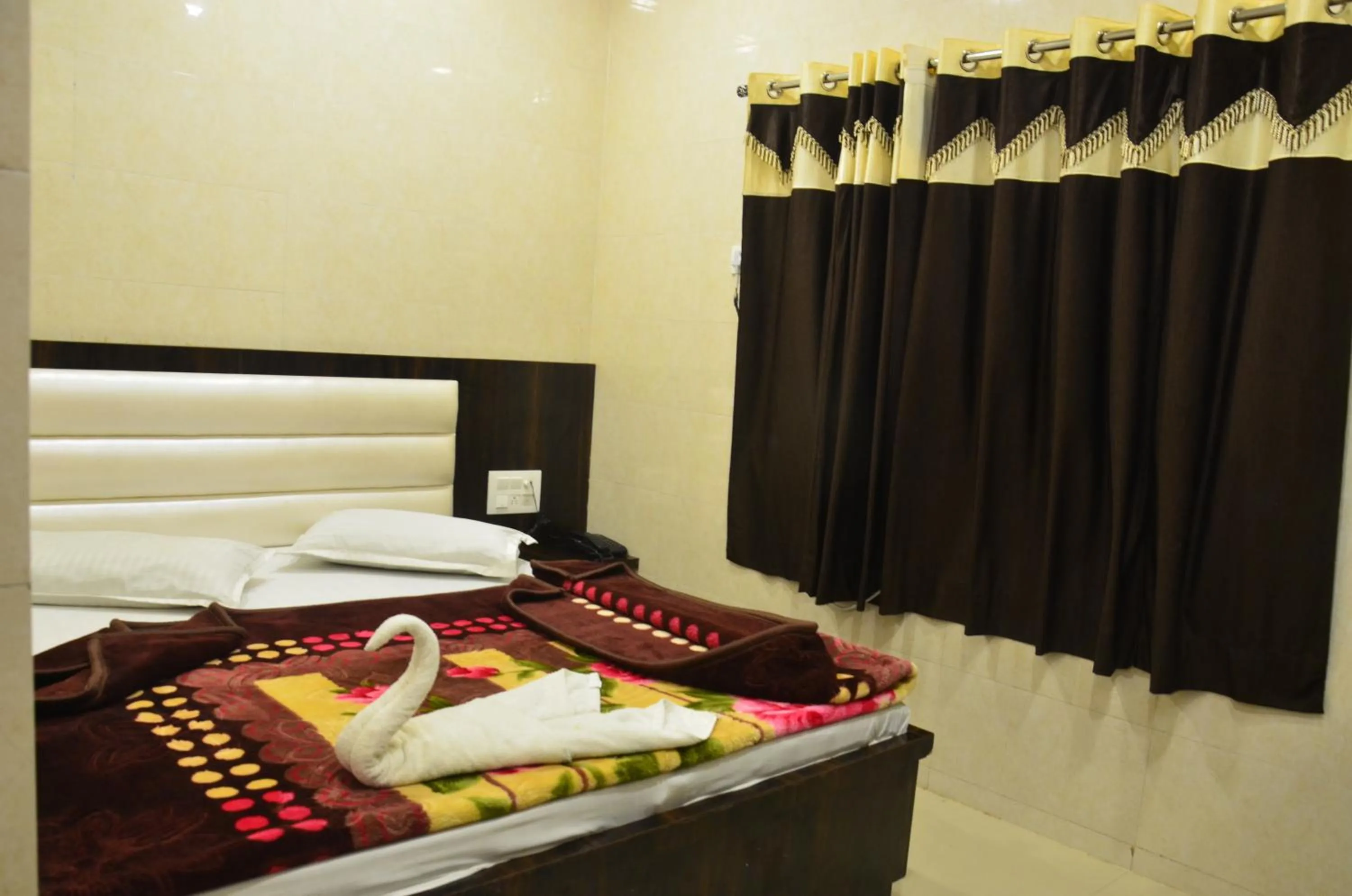 Bed in Ashiyana Inn Hotel