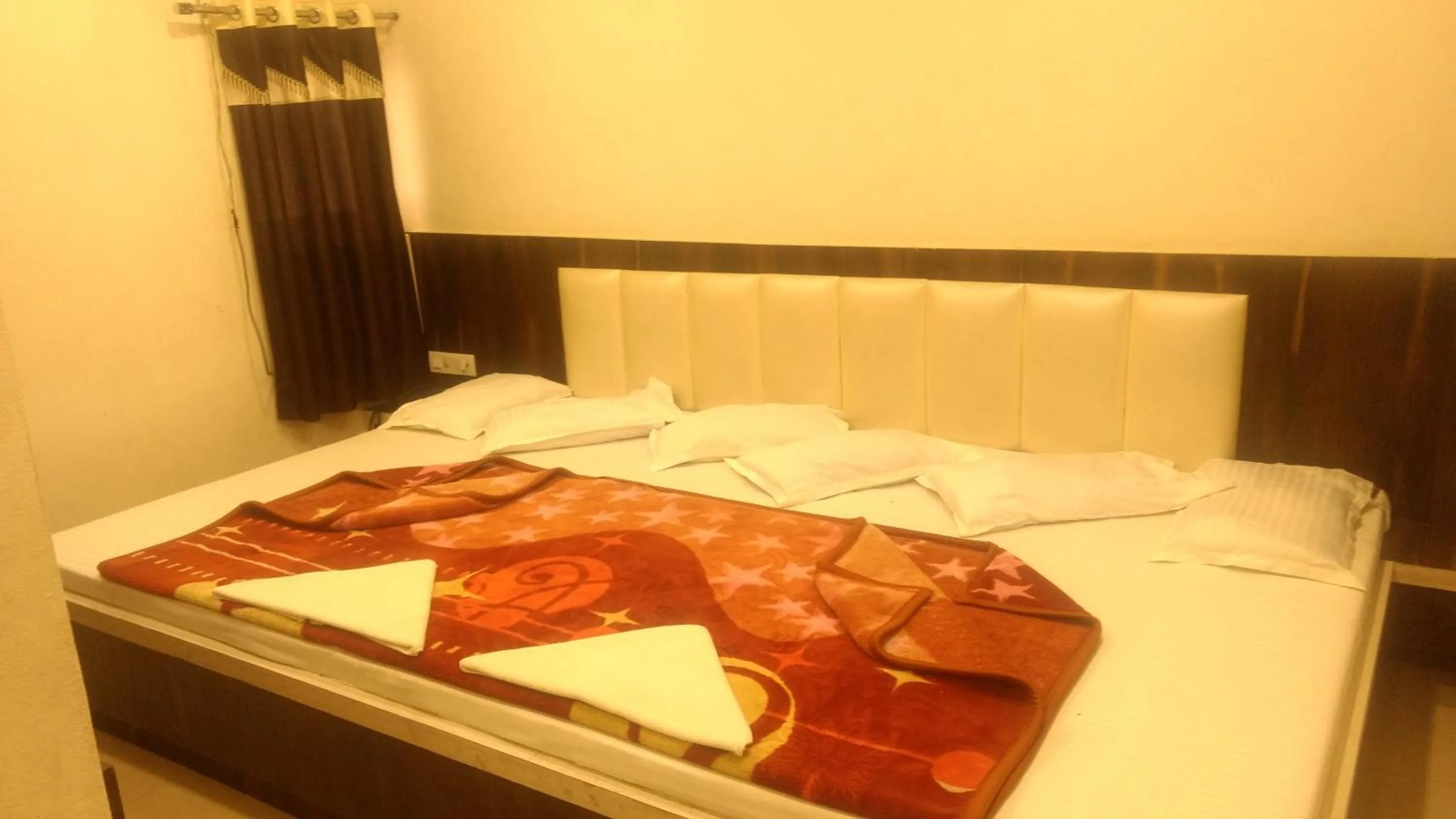 Bed in Ashiyana Inn Hotel