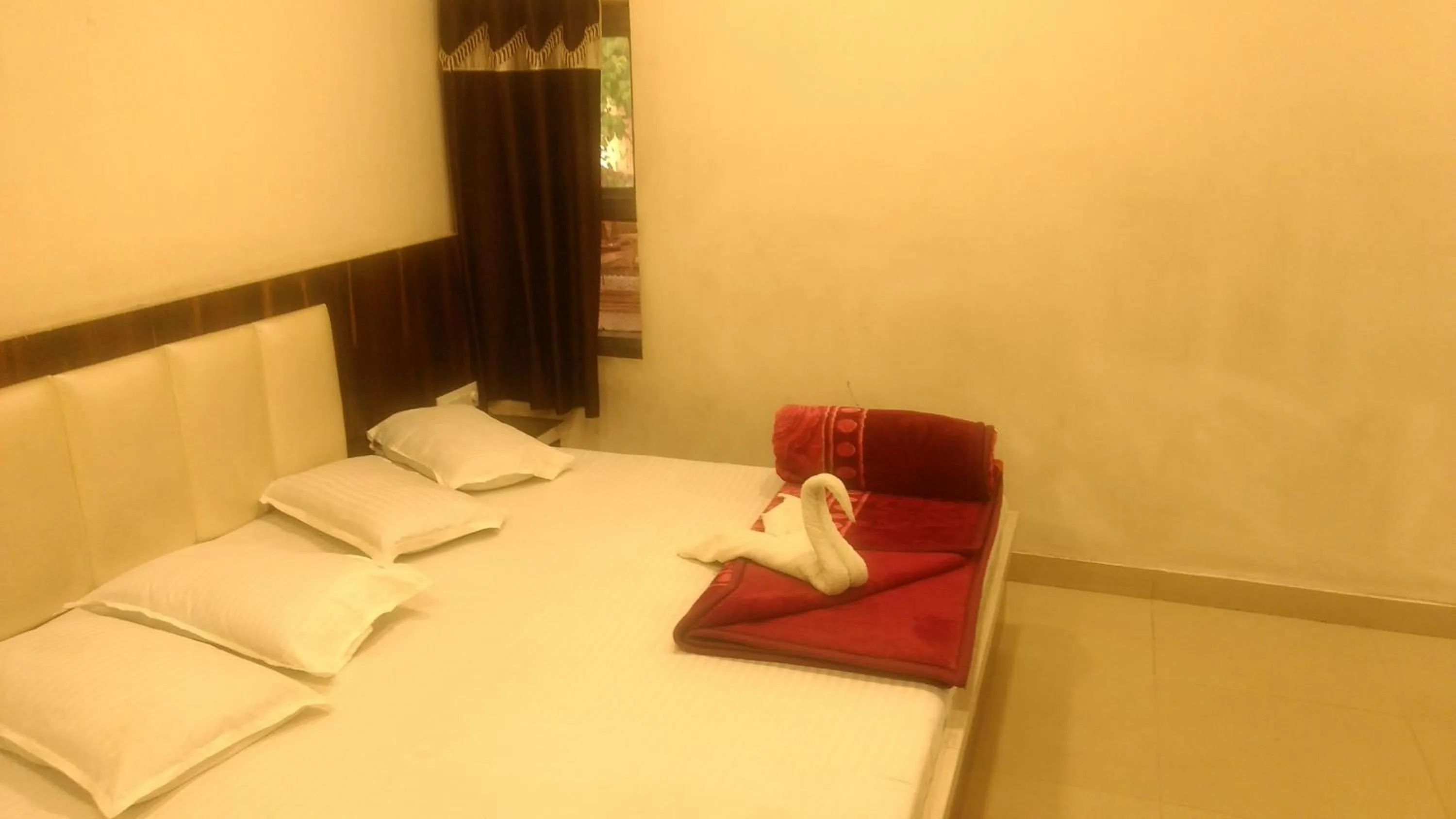Bed in Ashiyana Inn Hotel