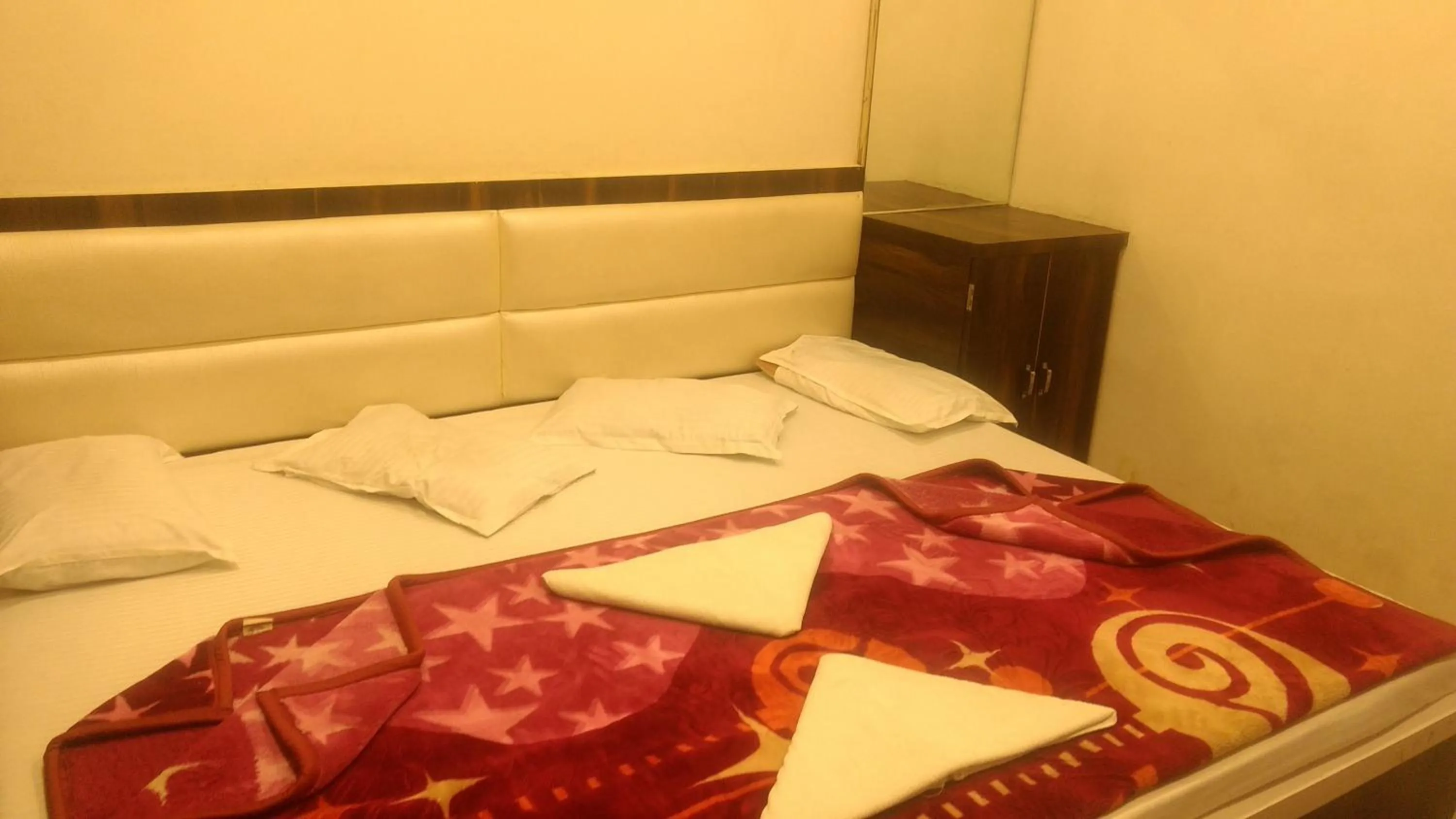 Bed in Ashiyana Inn Hotel