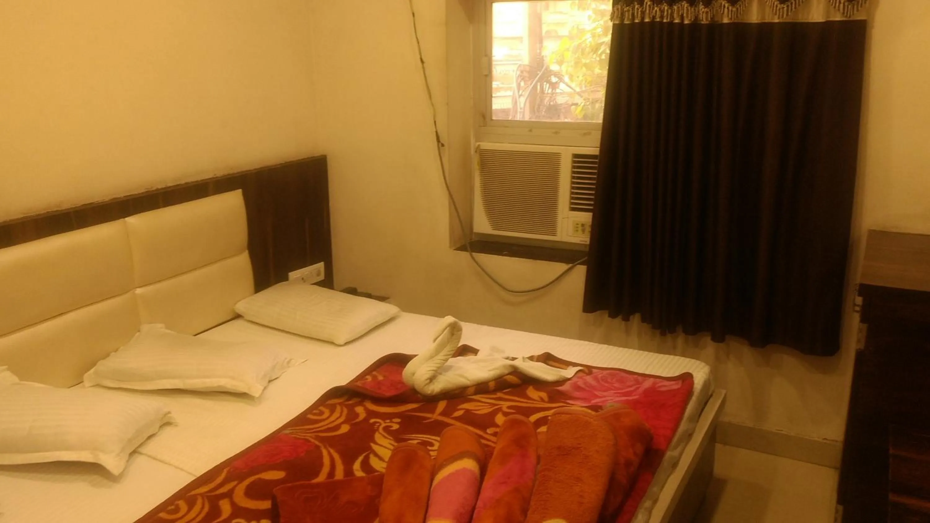 Bed in Ashiyana Inn Hotel