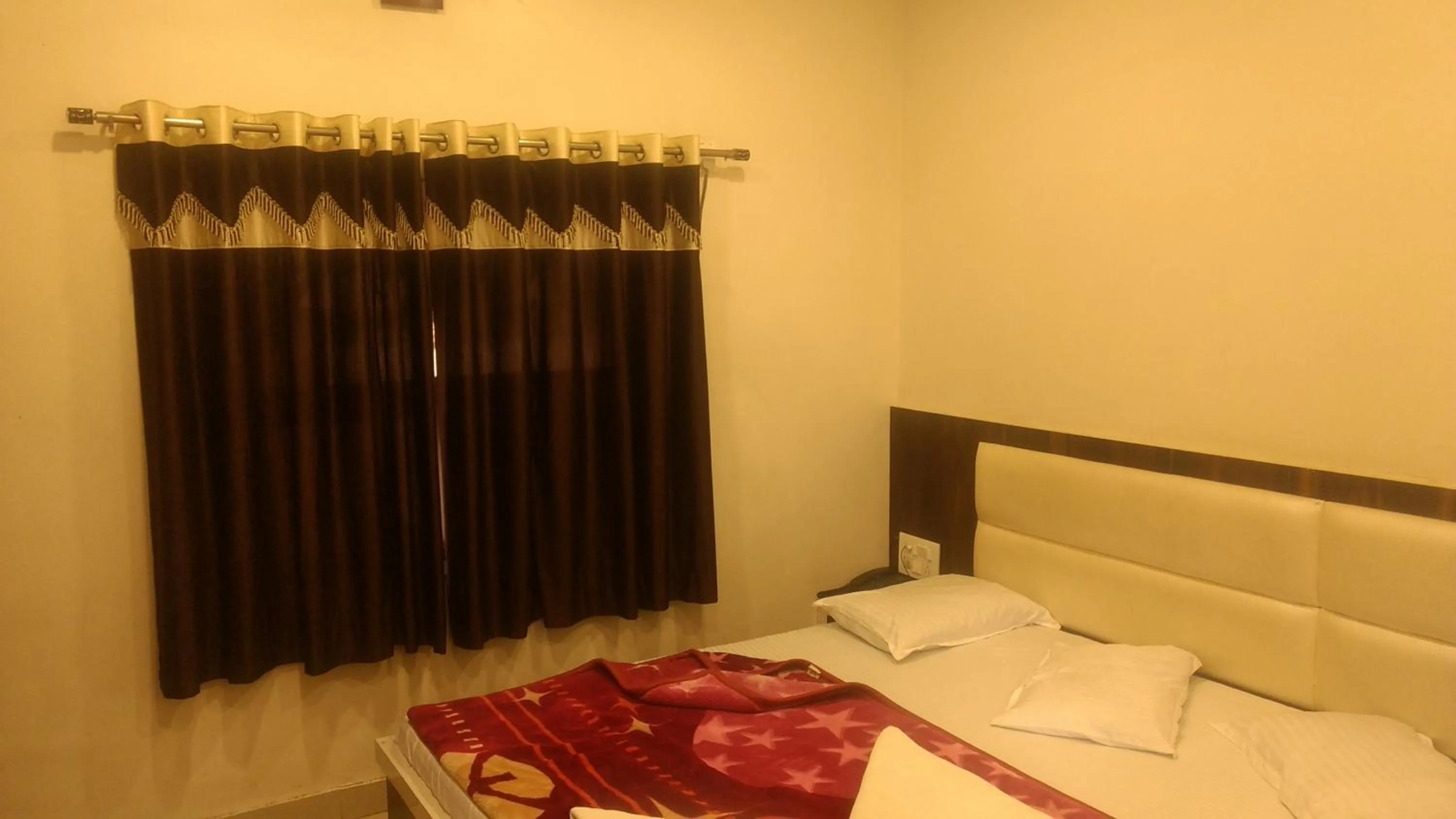 Bed in Ashiyana Inn Hotel