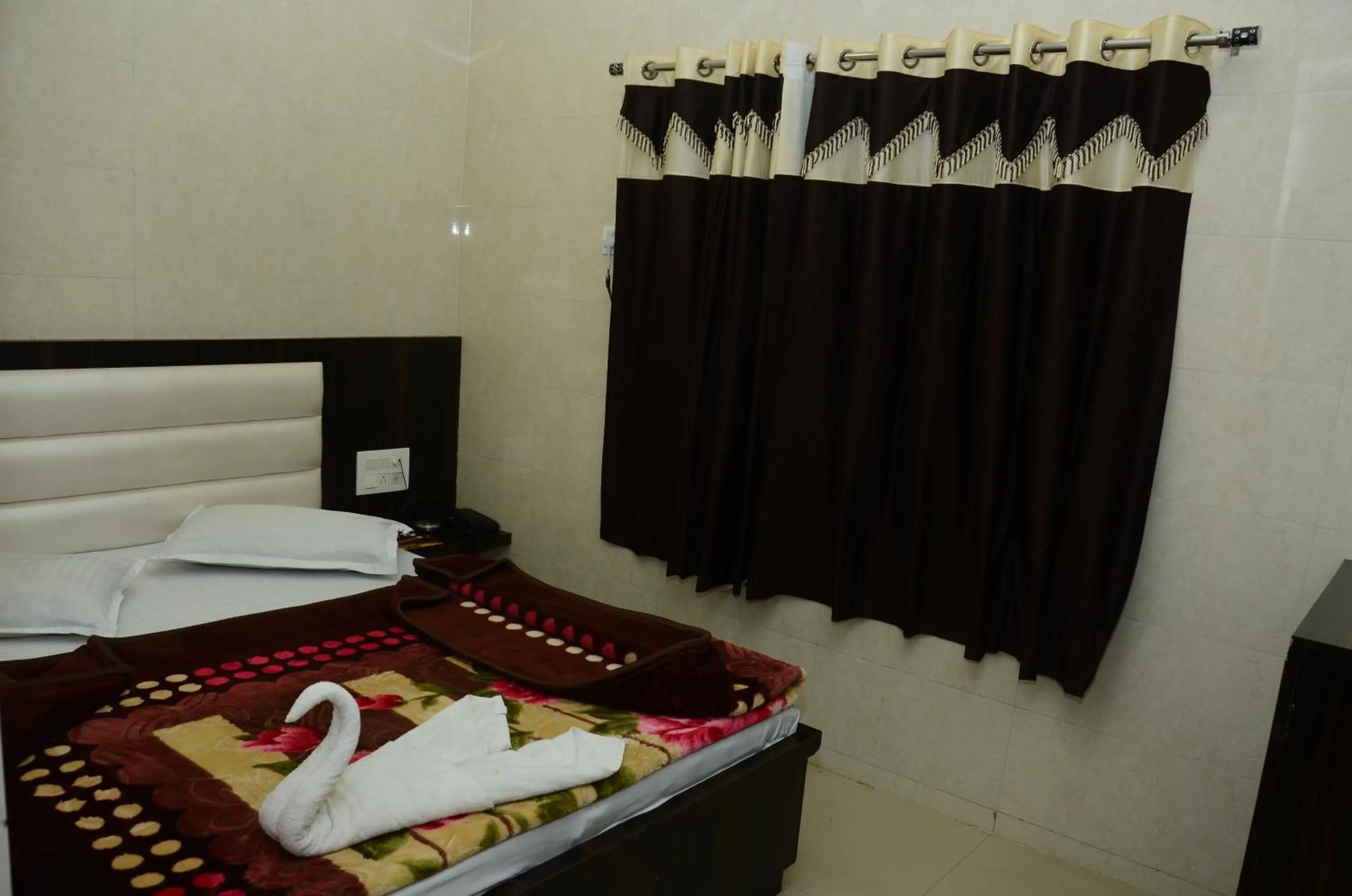 Bed in Ashiyana Inn Hotel