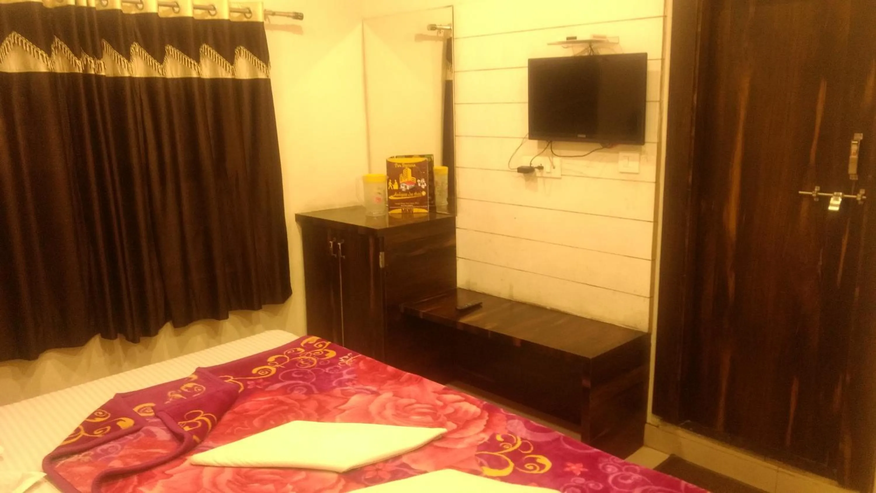 Bed in Ashiyana Inn Hotel