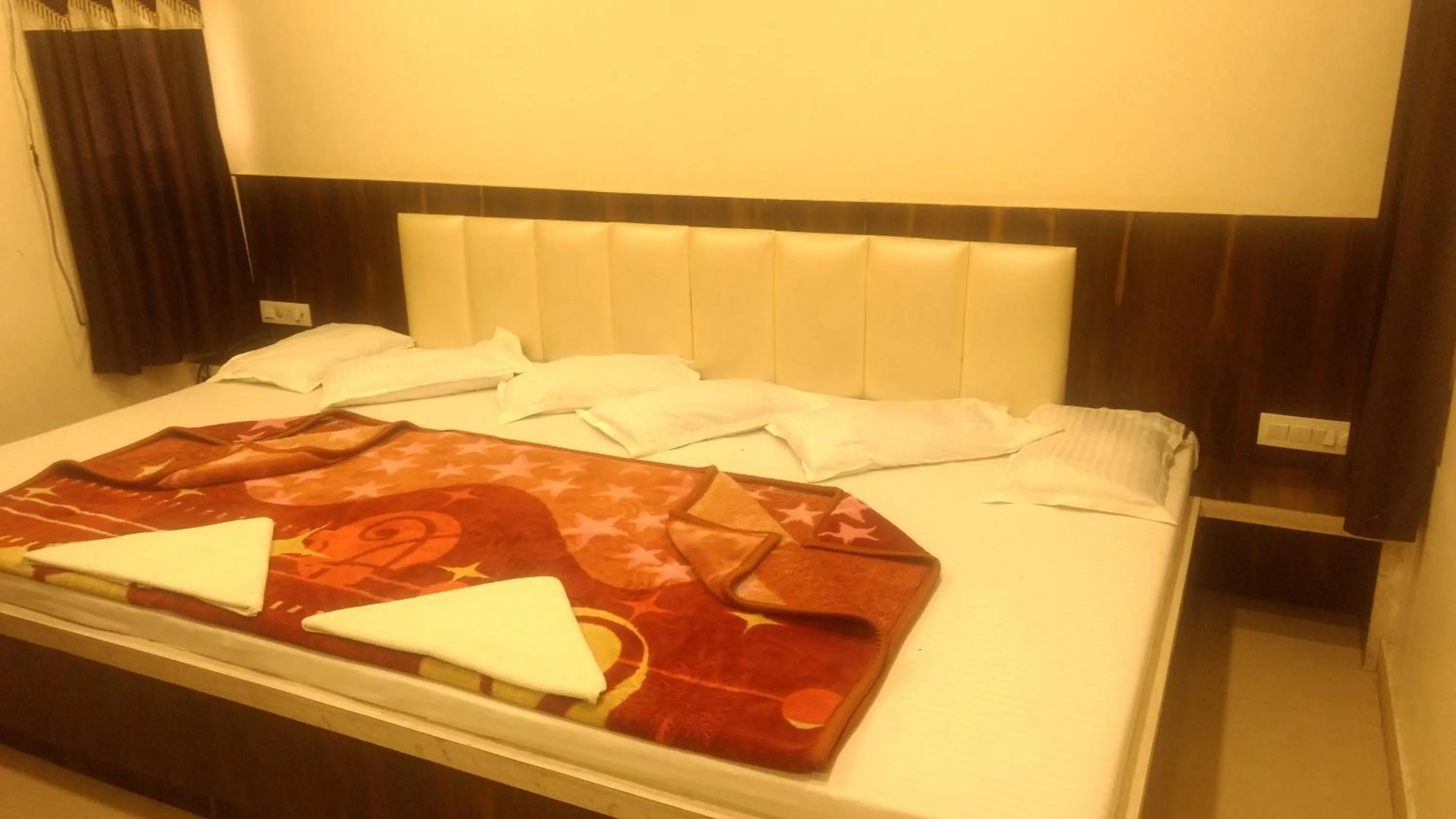 Bed in Ashiyana Inn Hotel