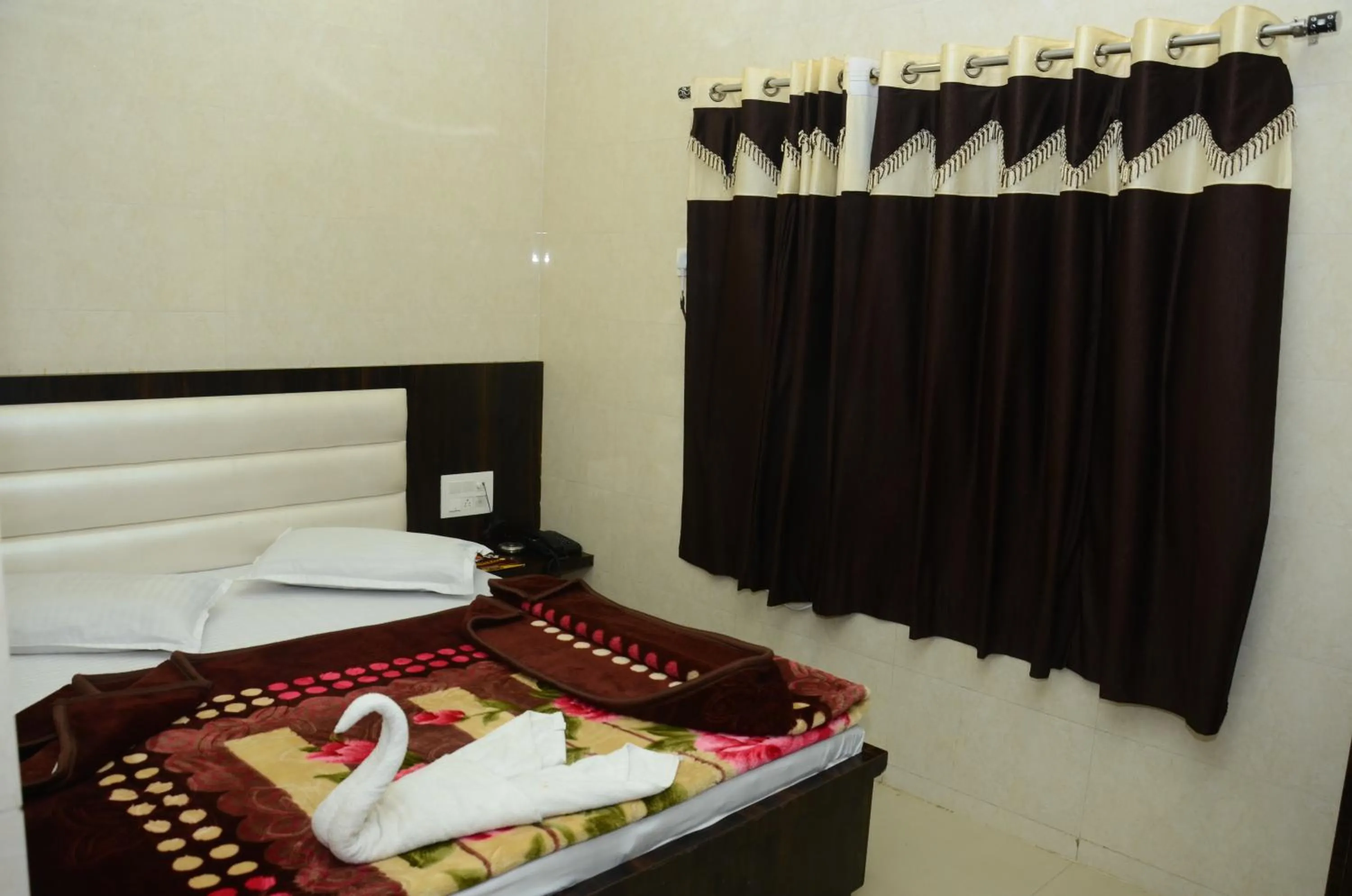 Bed in Ashiyana Inn Hotel