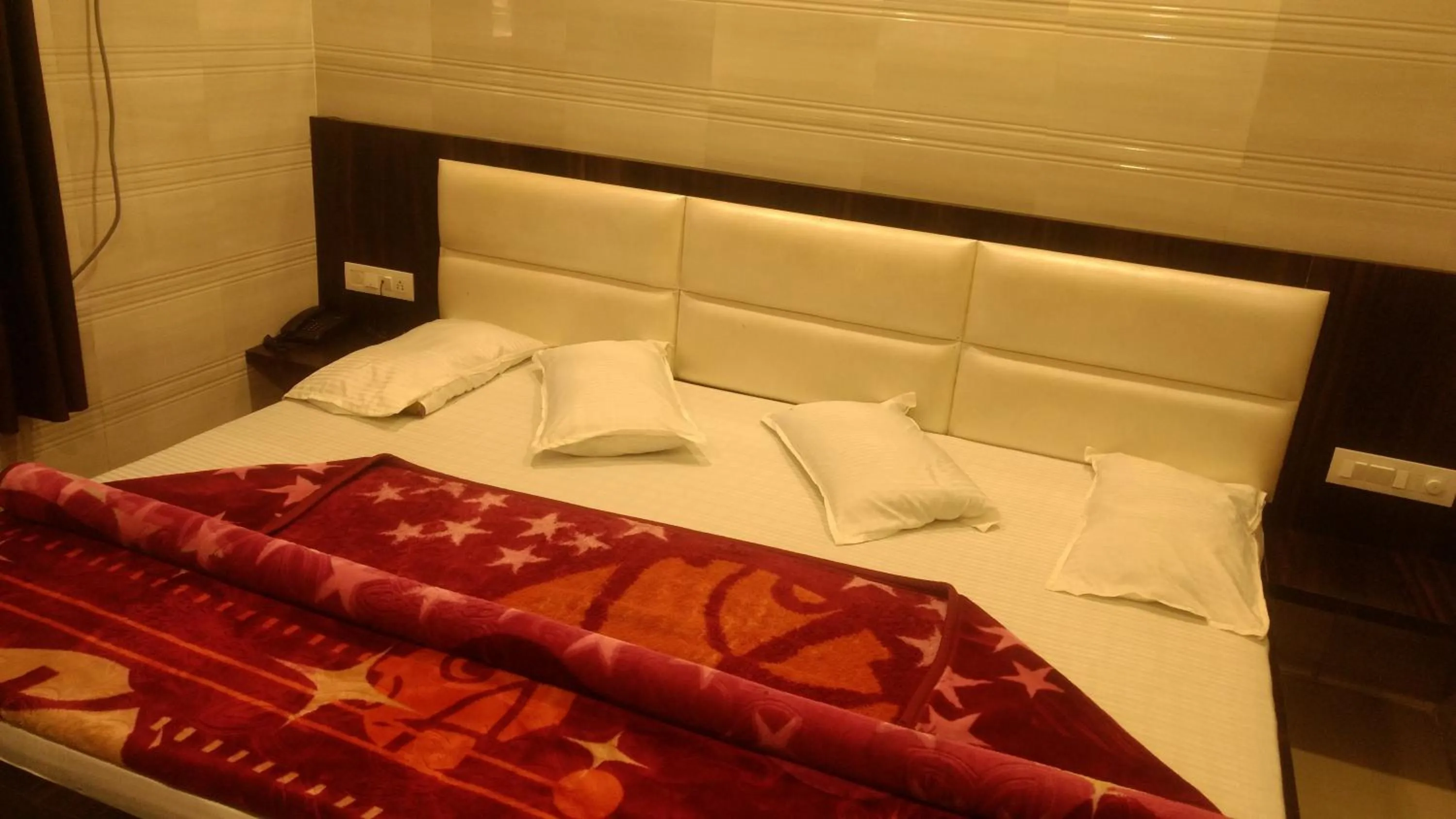 Bed in Ashiyana Inn Hotel