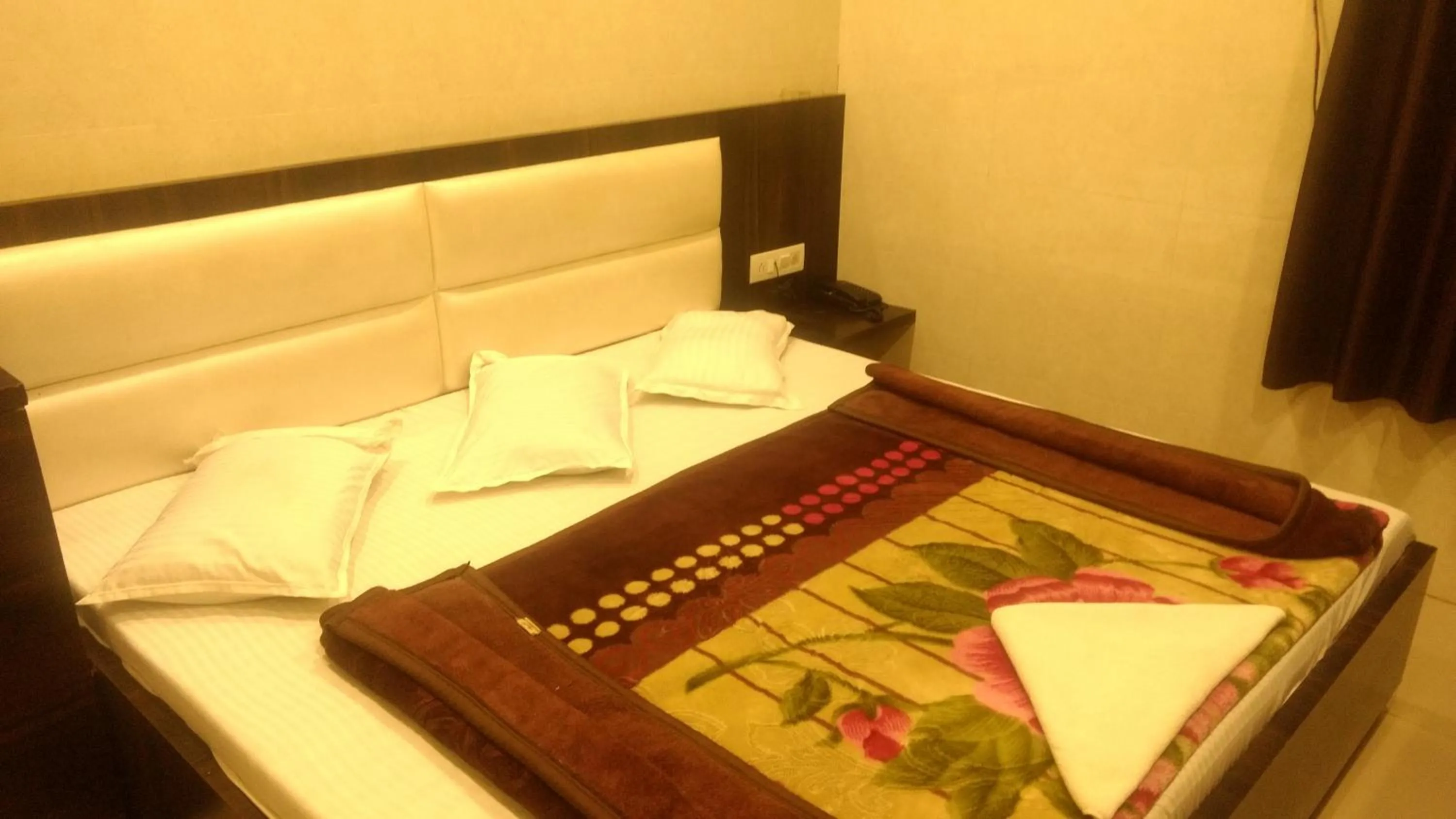 Bed in Ashiyana Inn Hotel