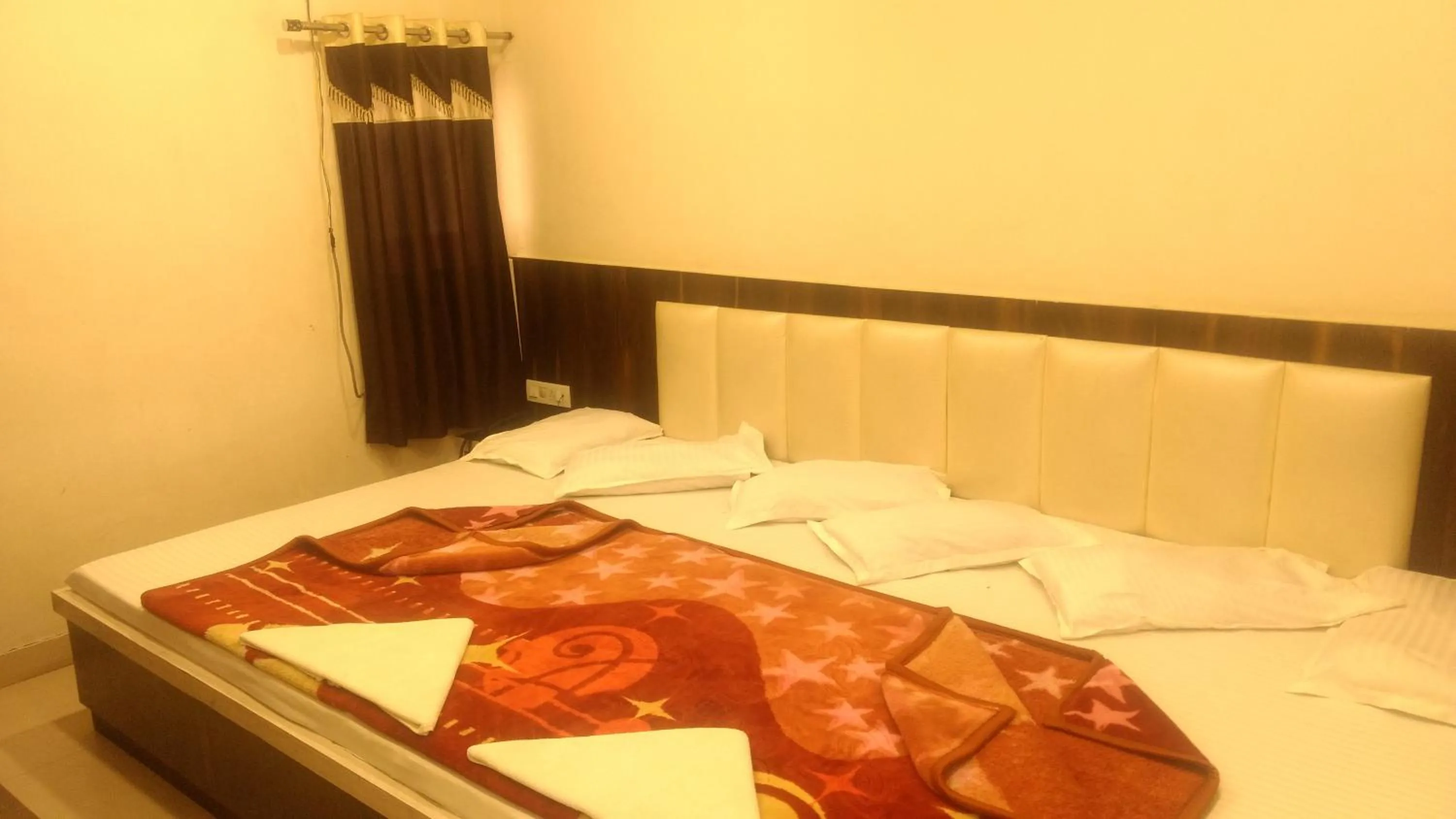 Bed in Ashiyana Inn Hotel