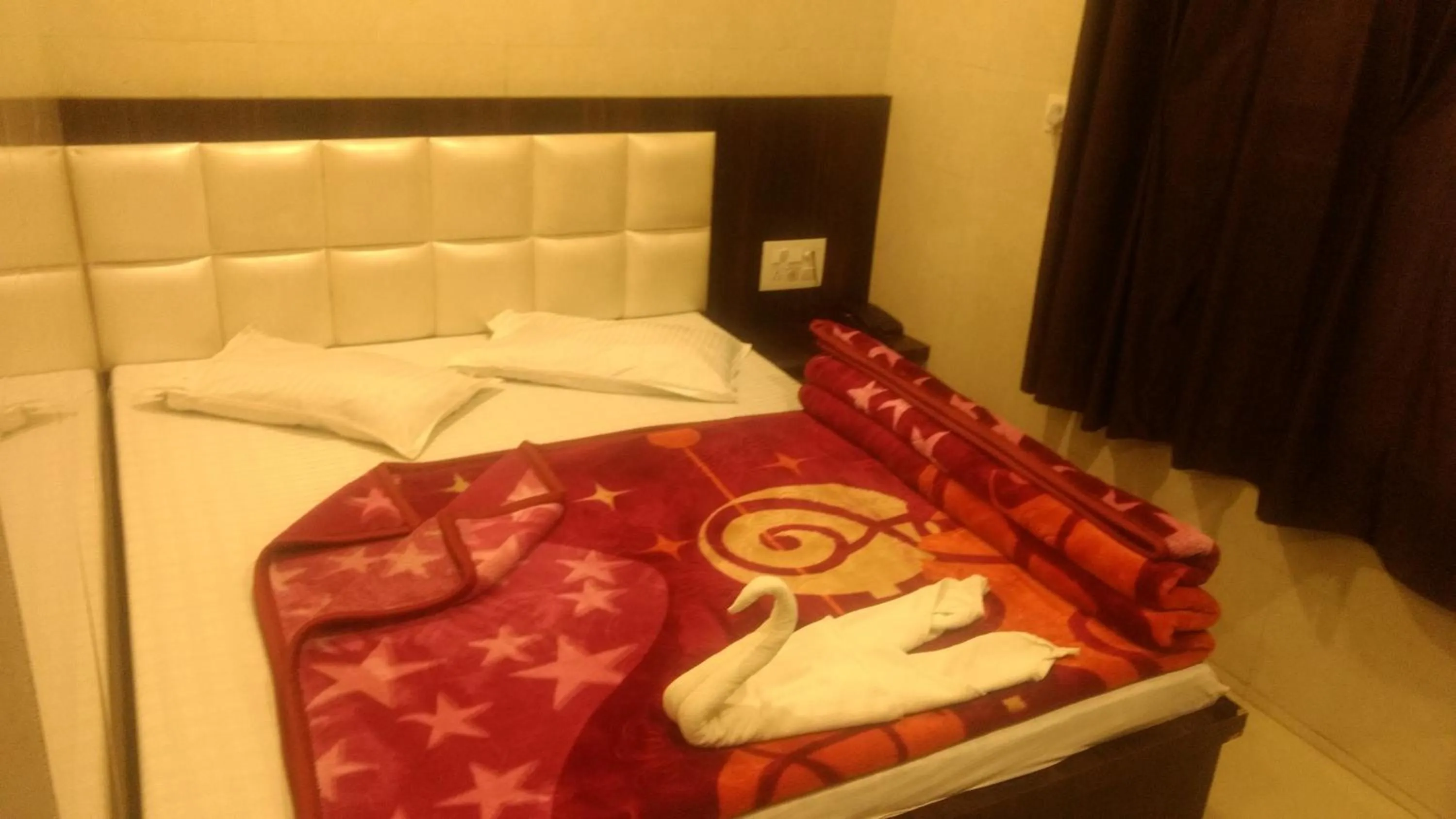 Bed in Ashiyana Inn Hotel