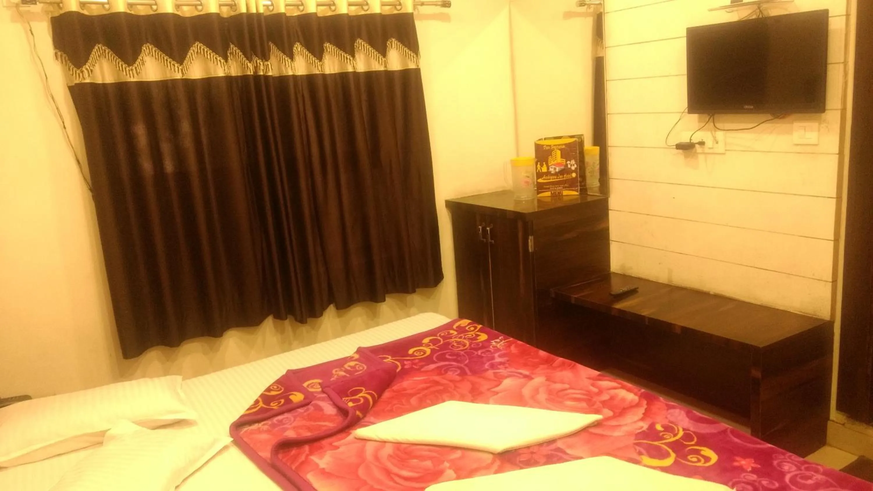Bed in Ashiyana Inn Hotel