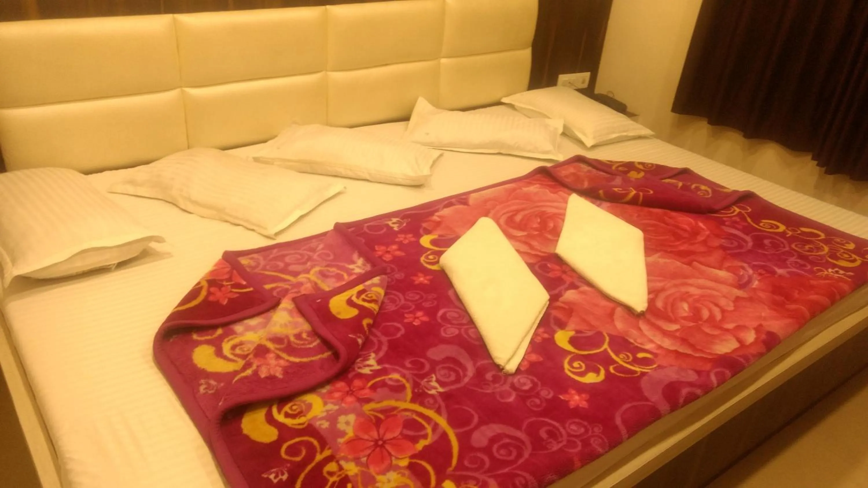 Bed in Ashiyana Inn Hotel