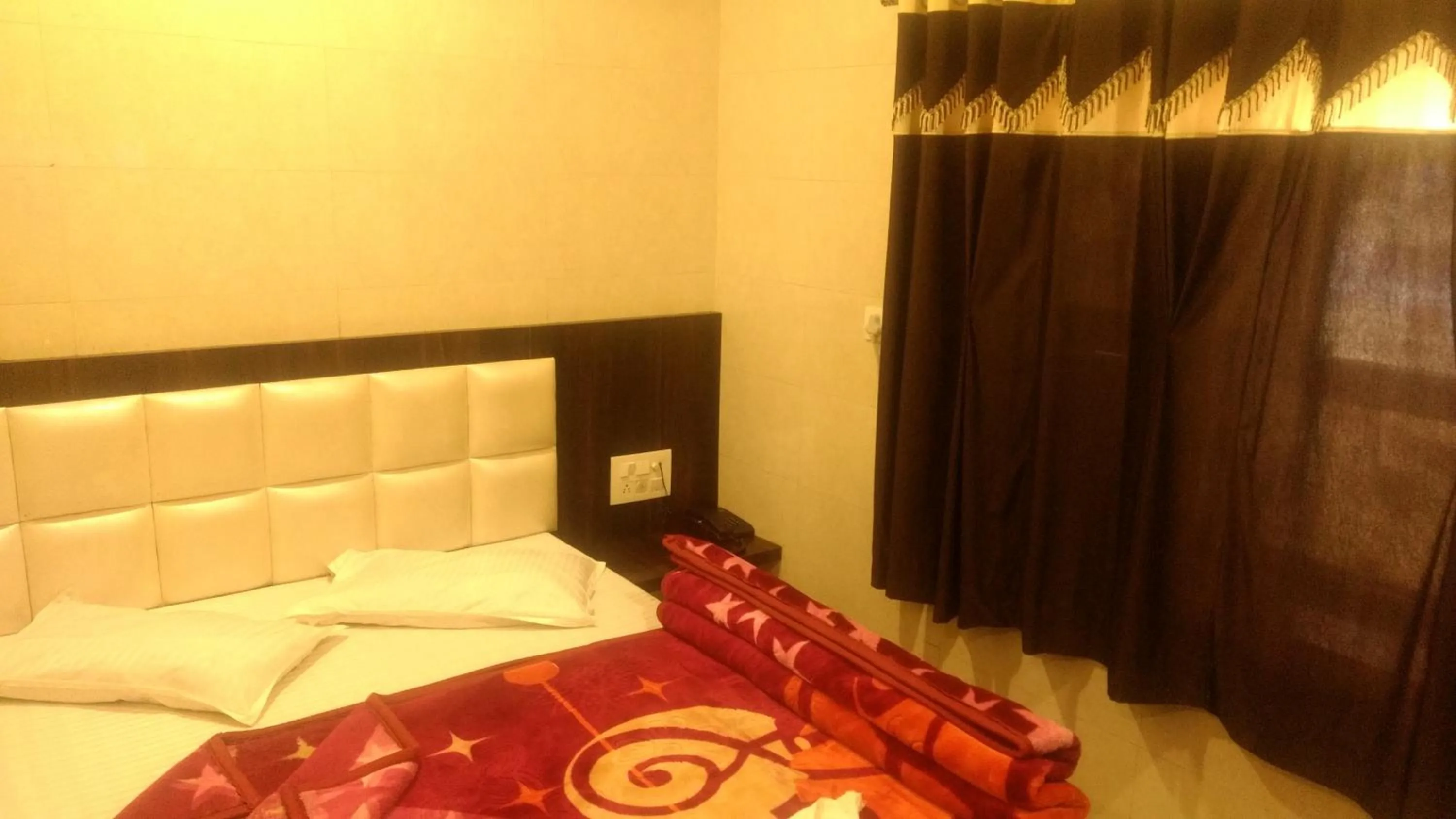 Bed in Ashiyana Inn Hotel