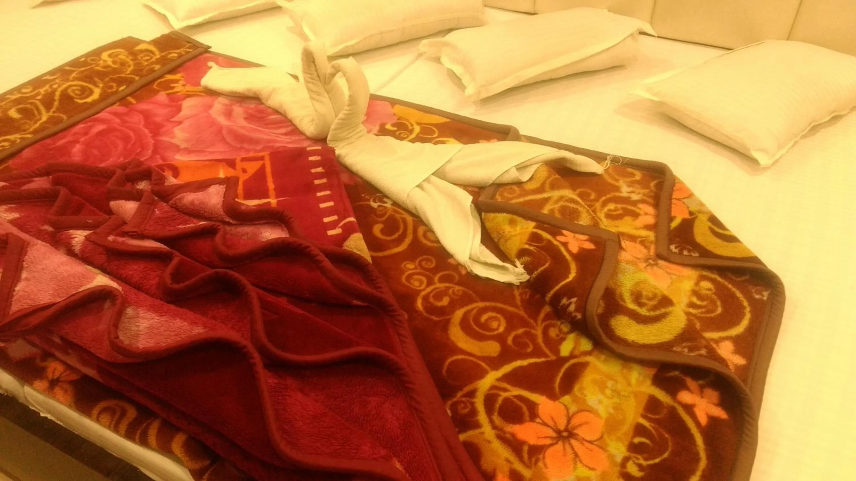 Bed in Ashiyana Inn Hotel