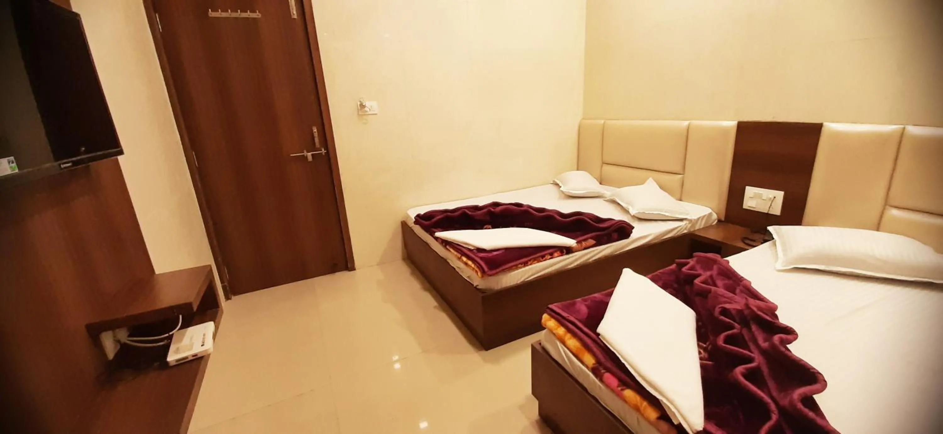 Bed in Ashiyana Inn Hotel