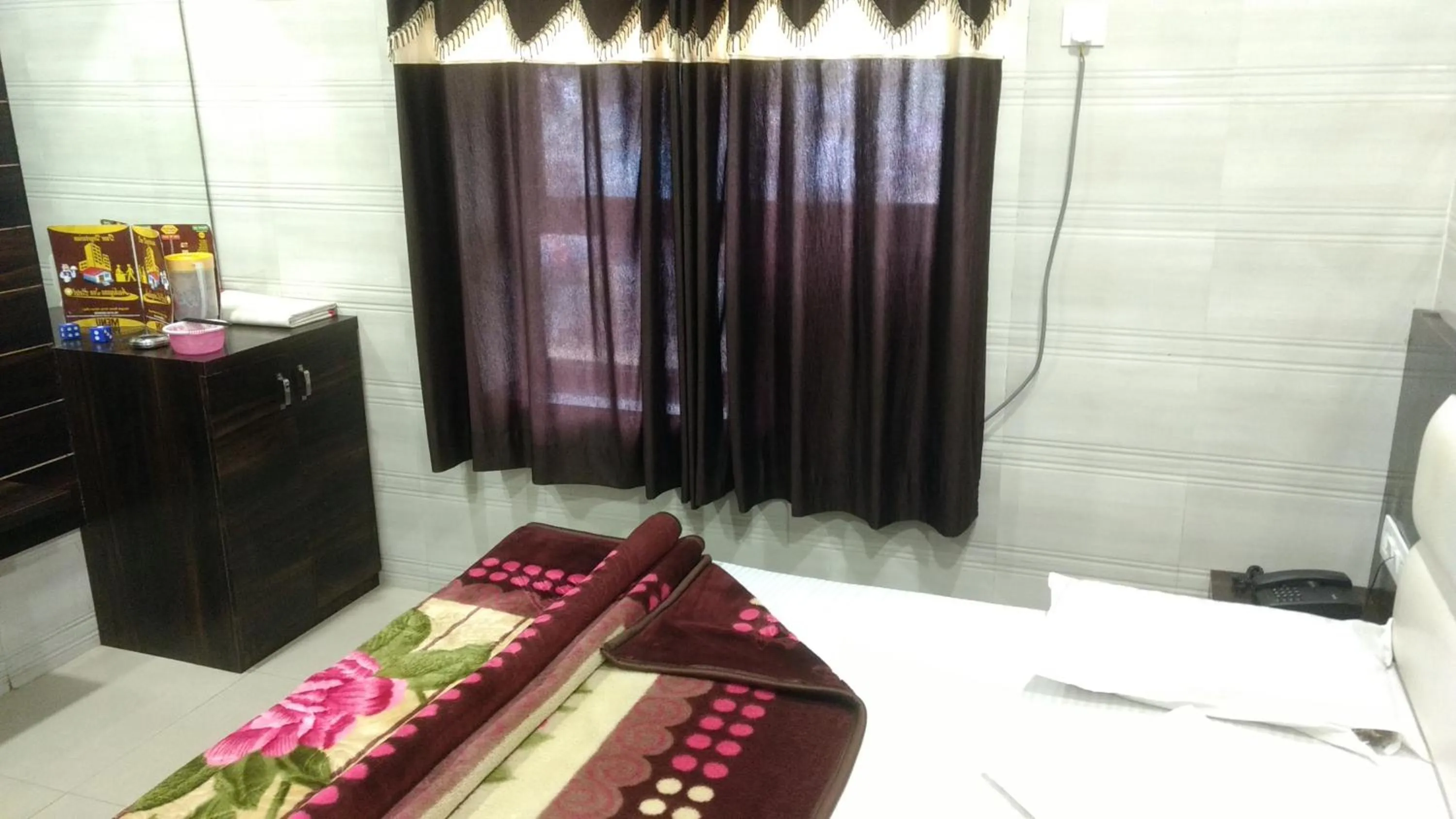 Bed in Ashiyana Inn Hotel